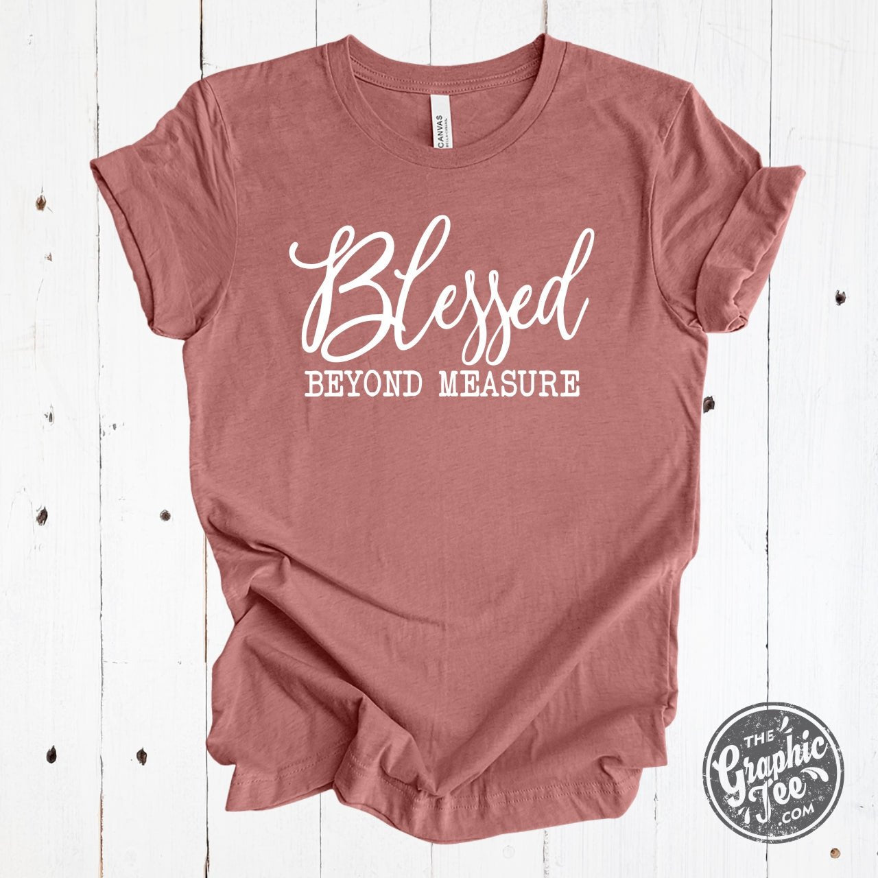 Heather mauve Blessed Beyond Measure graphic tee by The Graphic Tee, showcasing a stylish short-sleeve design with inspirational text.