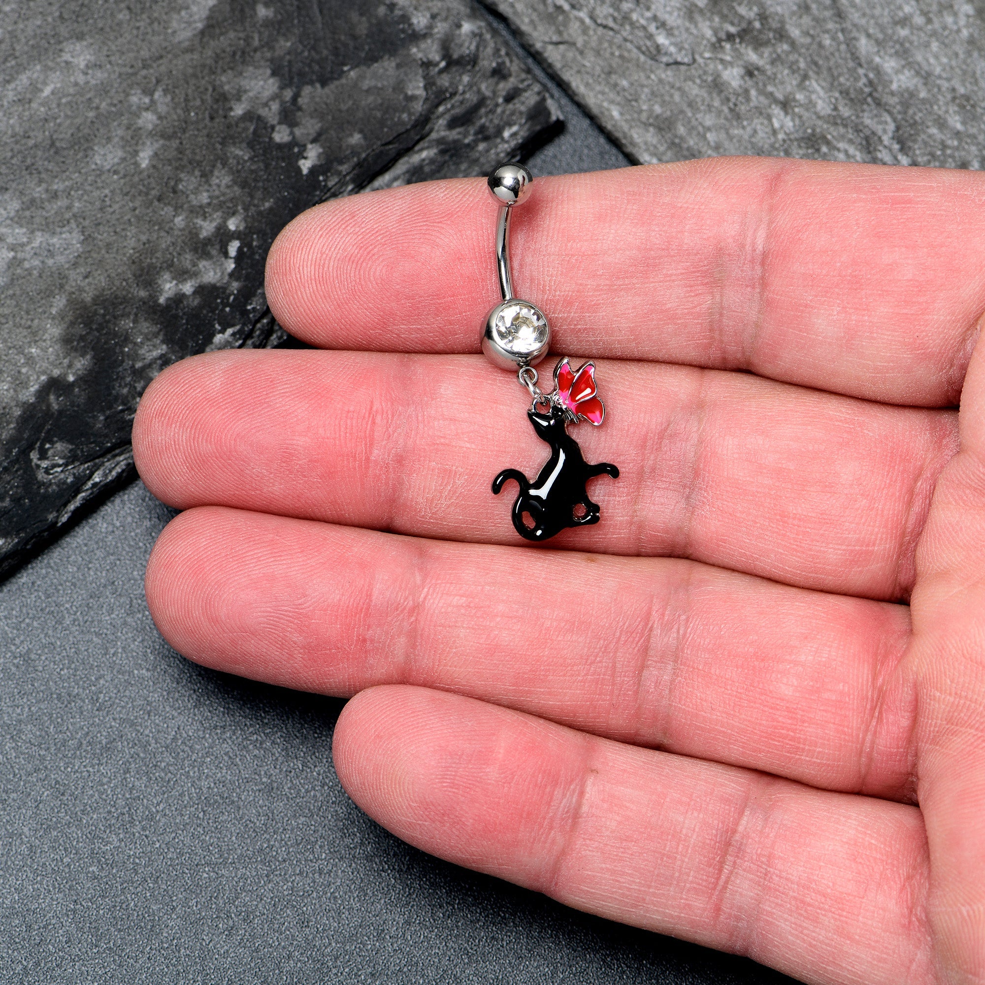 Clear gem butterfly and black cat dangle belly ring from BodyCandy, featuring a decorative hanging design for pierced navel.