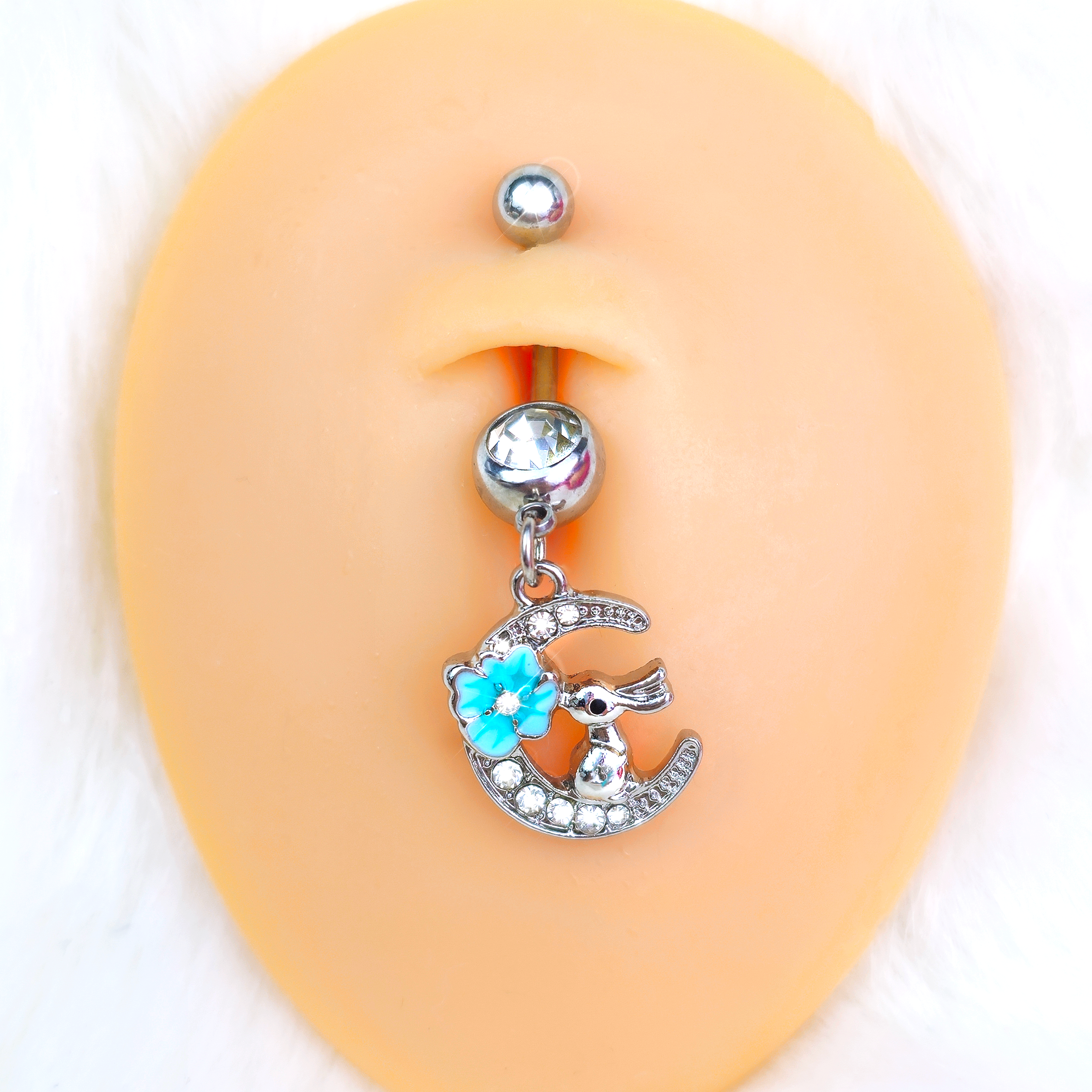 Clear gem rabbit on the moon blue dangle belly ring by BodyCandy, featuring a cute rabbit charm and sparkling gem accents.