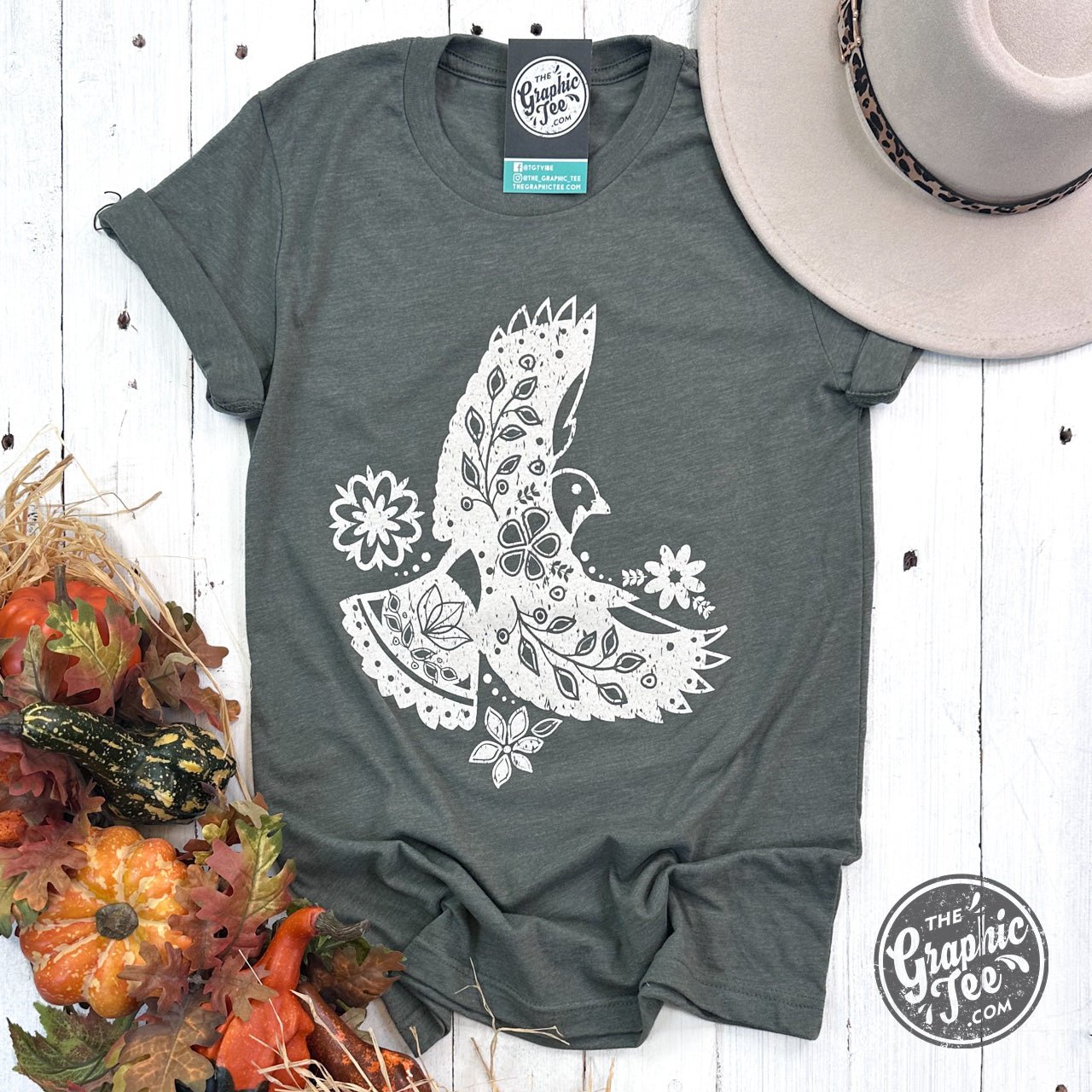 Military green boho bird graphic tee from The Graphic Tee featuring short sleeves and a casual style.