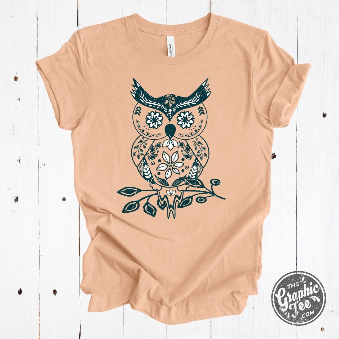 Heather peach short sleeve graphic tee featuring a boho owl design by The Graphic Tee.
