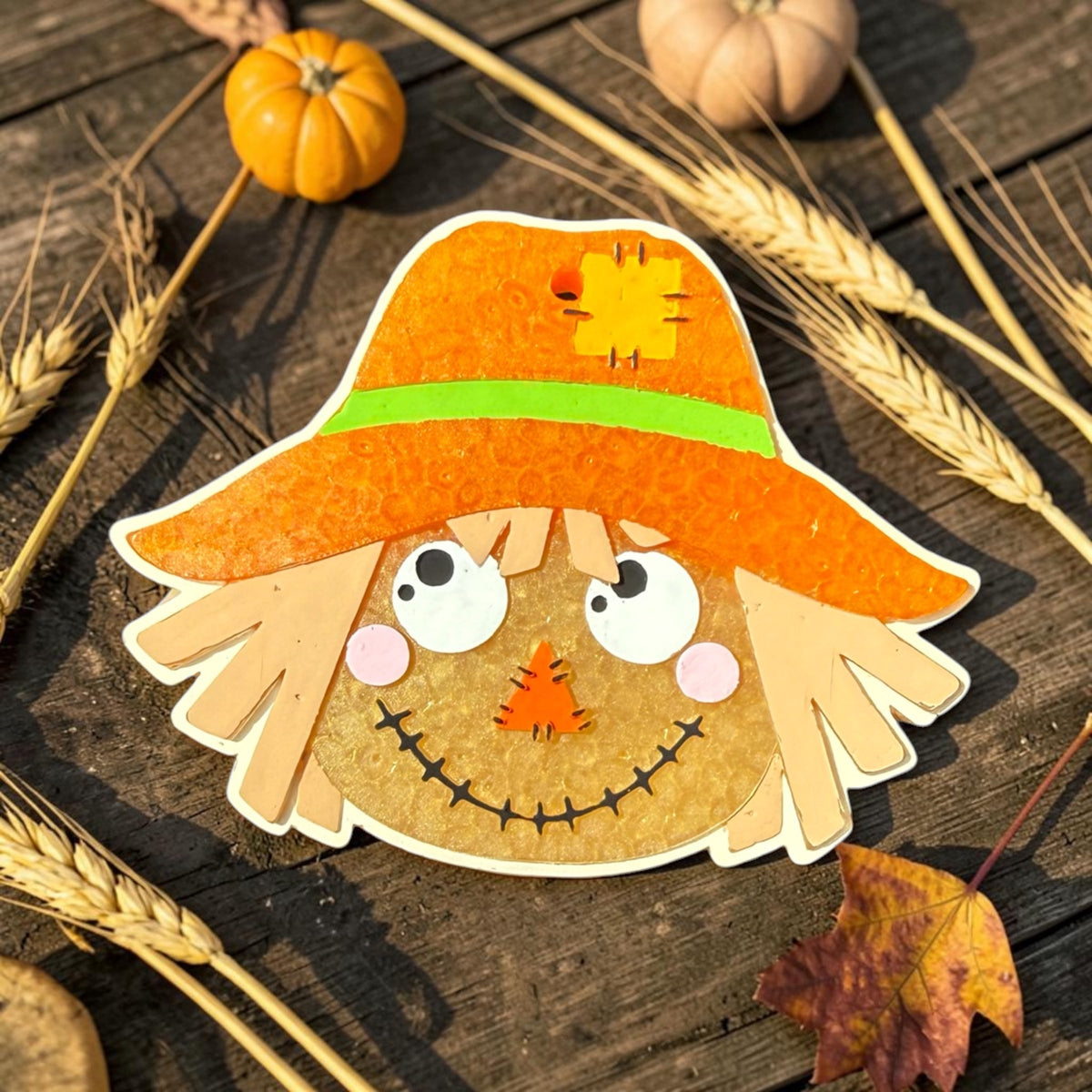 Bug & Bean Freshies scarecrow-shaped air freshener with a cheerful scarecrow figure and colorful fall-inspired design.