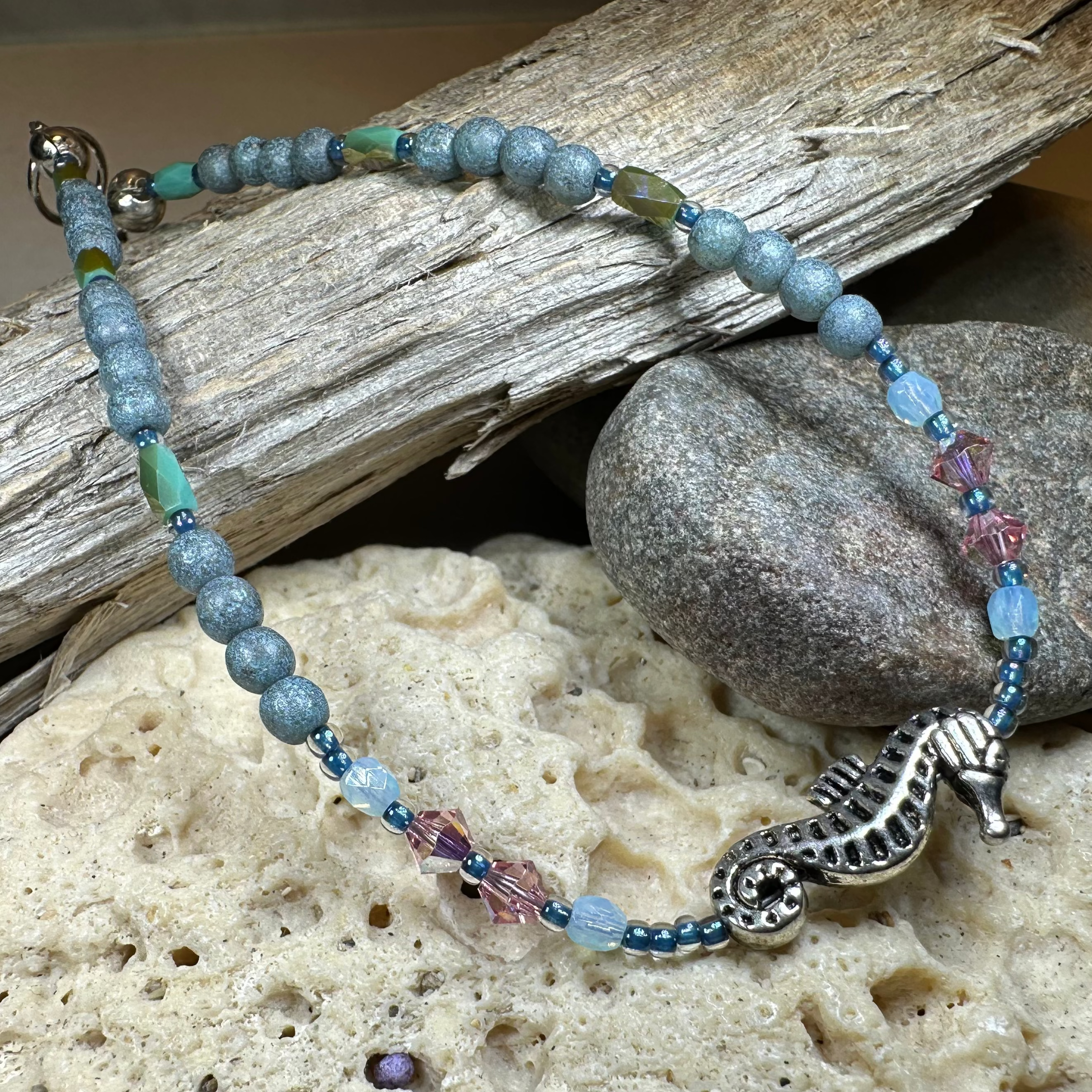 Green and pink beachy seahorse ankle bracelet by Celtic Crystal Design Jewelry, featuring intricate sea-inspired details.