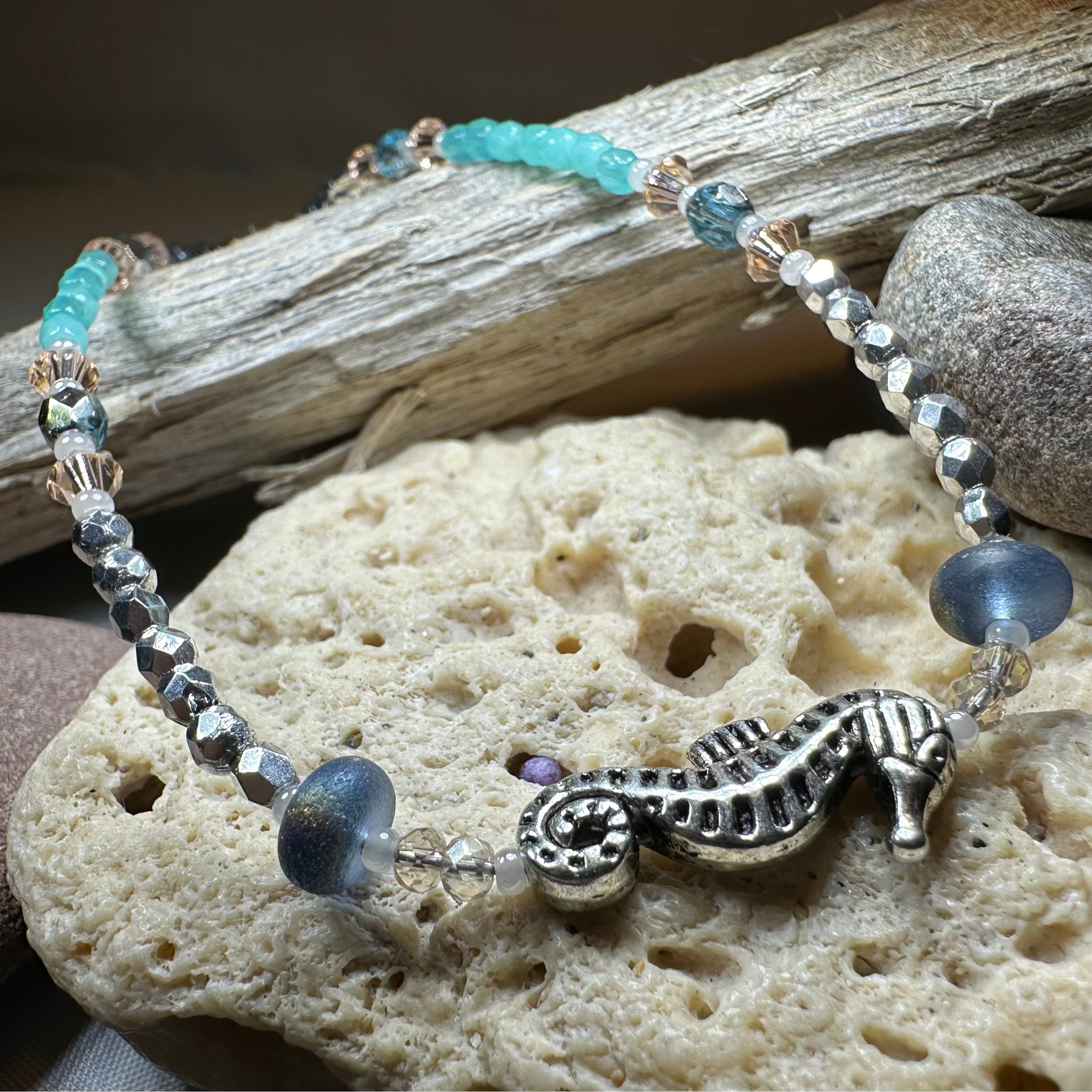 Beachy Seahorse ankle bracelet by Celtic Crystal Design Jewelry featuring green and pink beads with a seahorse charm.