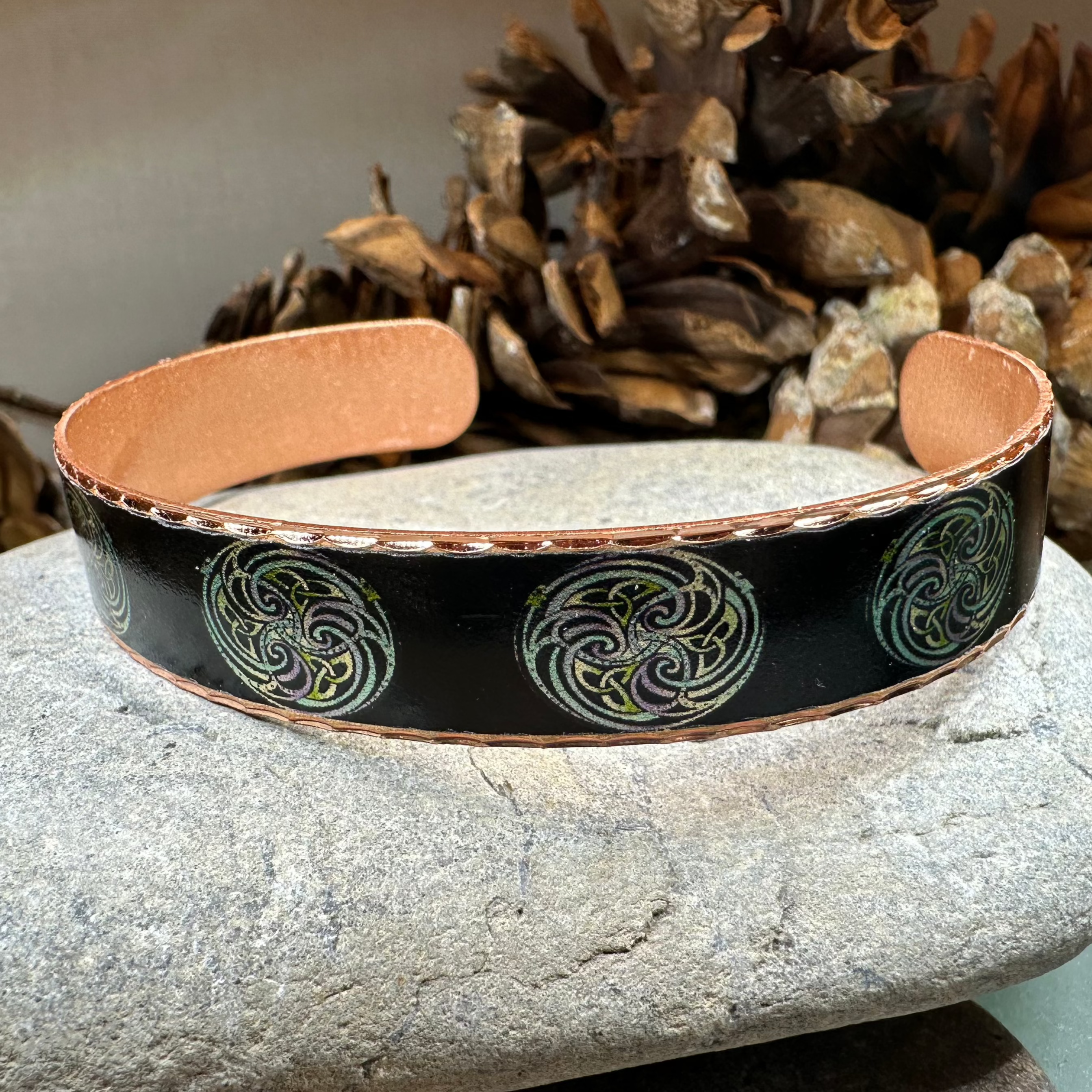 Mystical Celtic Spiral Copper Cuff Bracelet by Celtic Crystal Design Jewelry, featuring intricate spiral patterns on a polished copper surface.