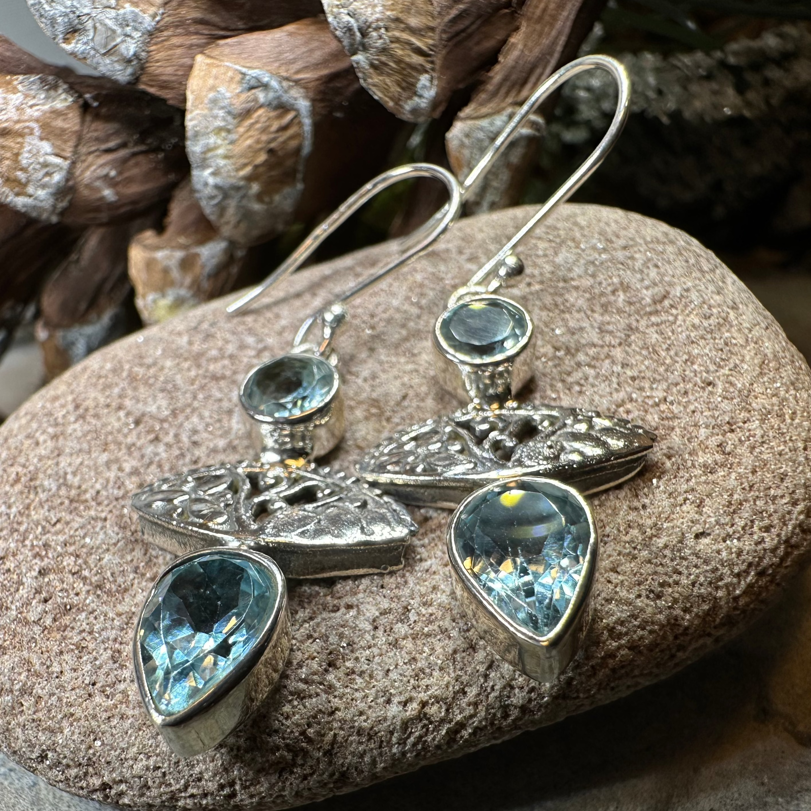 Celtic Morning Blue Topaz Dangle Earrings by Celtic Crystal Design Jewelry, featuring sparkling blue topaz stones and intricate Celtic patterns.