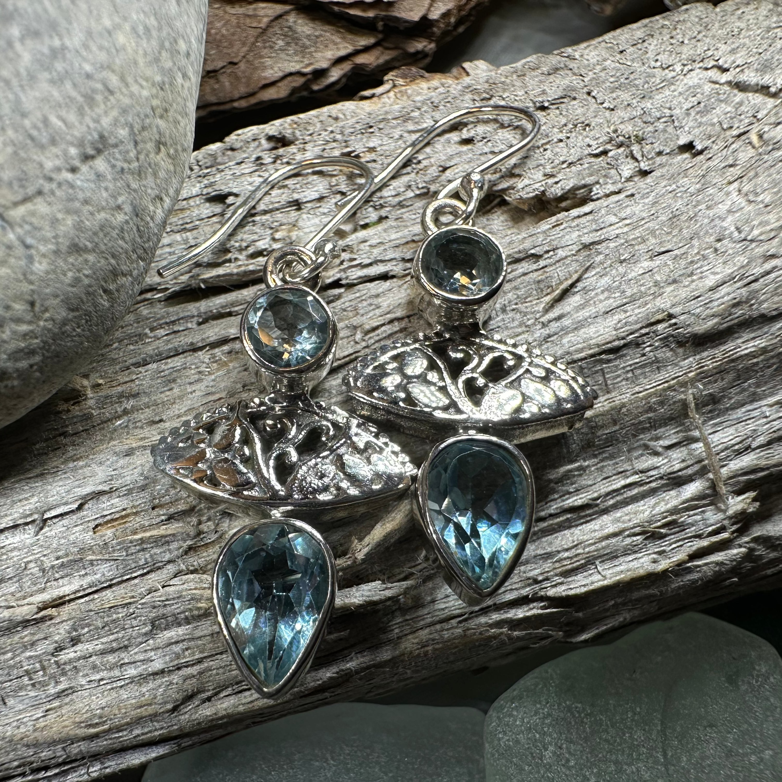 Celtic Morning Blue Topaz Dangle Earrings featuring Celtic crystal design with sparkling blue topaz gemstones.