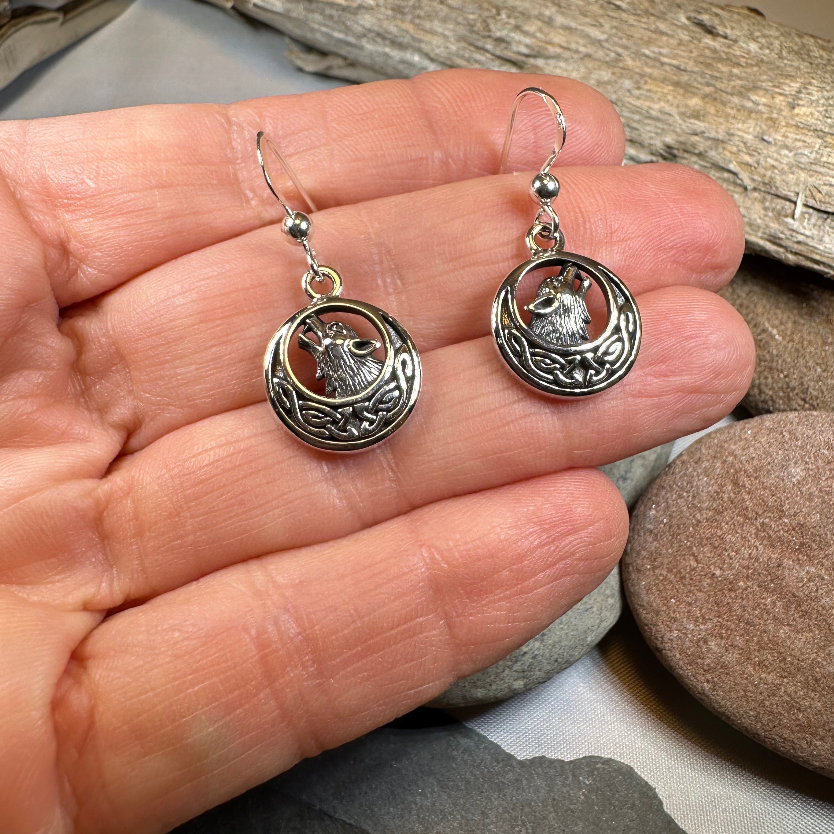 Celtic Wolf Spirit dangle earrings by Celtic Crystal Design Jewelry featuring intricate Celtic wolf motifs and sparkling crystal accents.