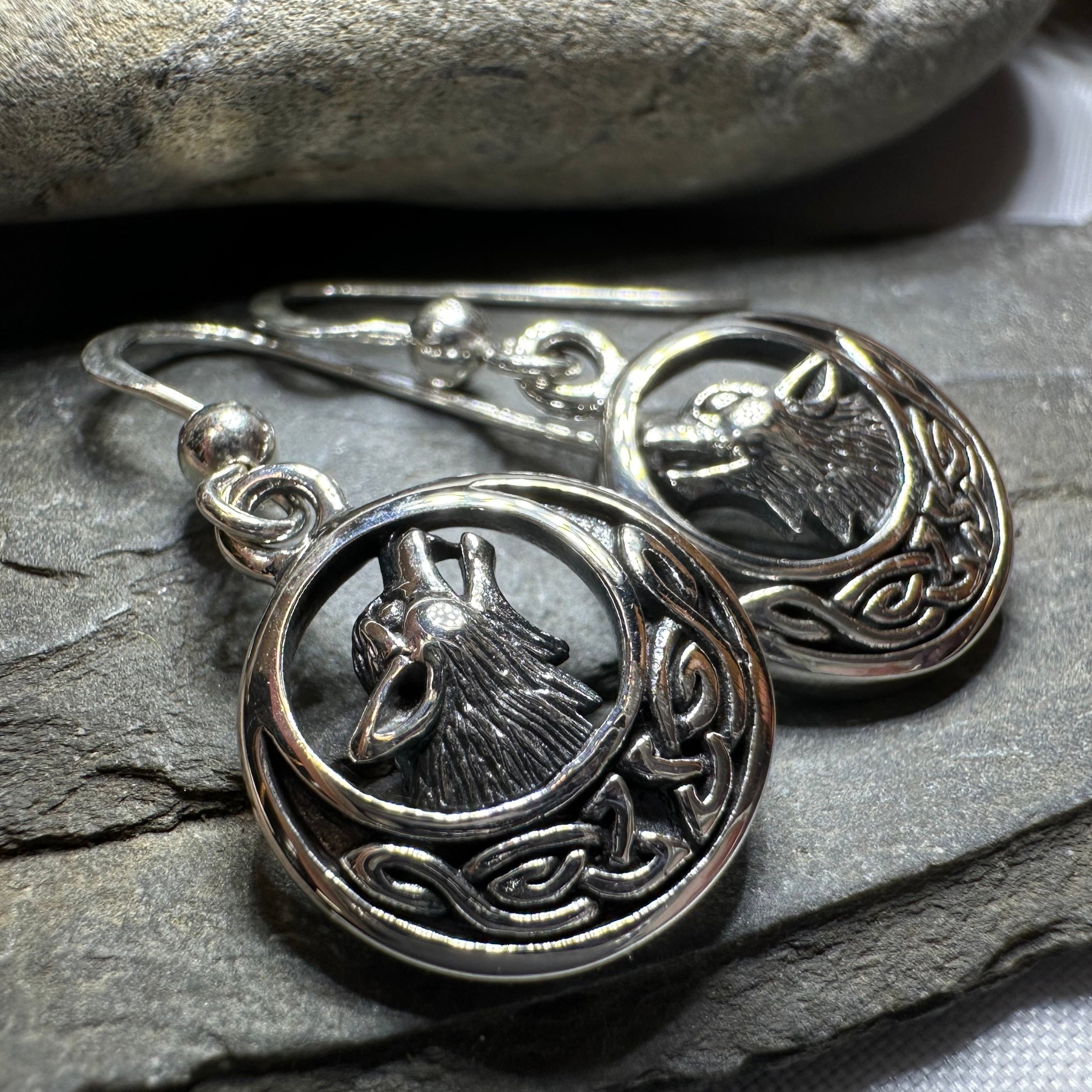 Celtic Wolf Spirit Dangle Earrings by Celtic Crystal Design Jewelry featuring intricate wolf and Celtic knot patterns in silver tone.