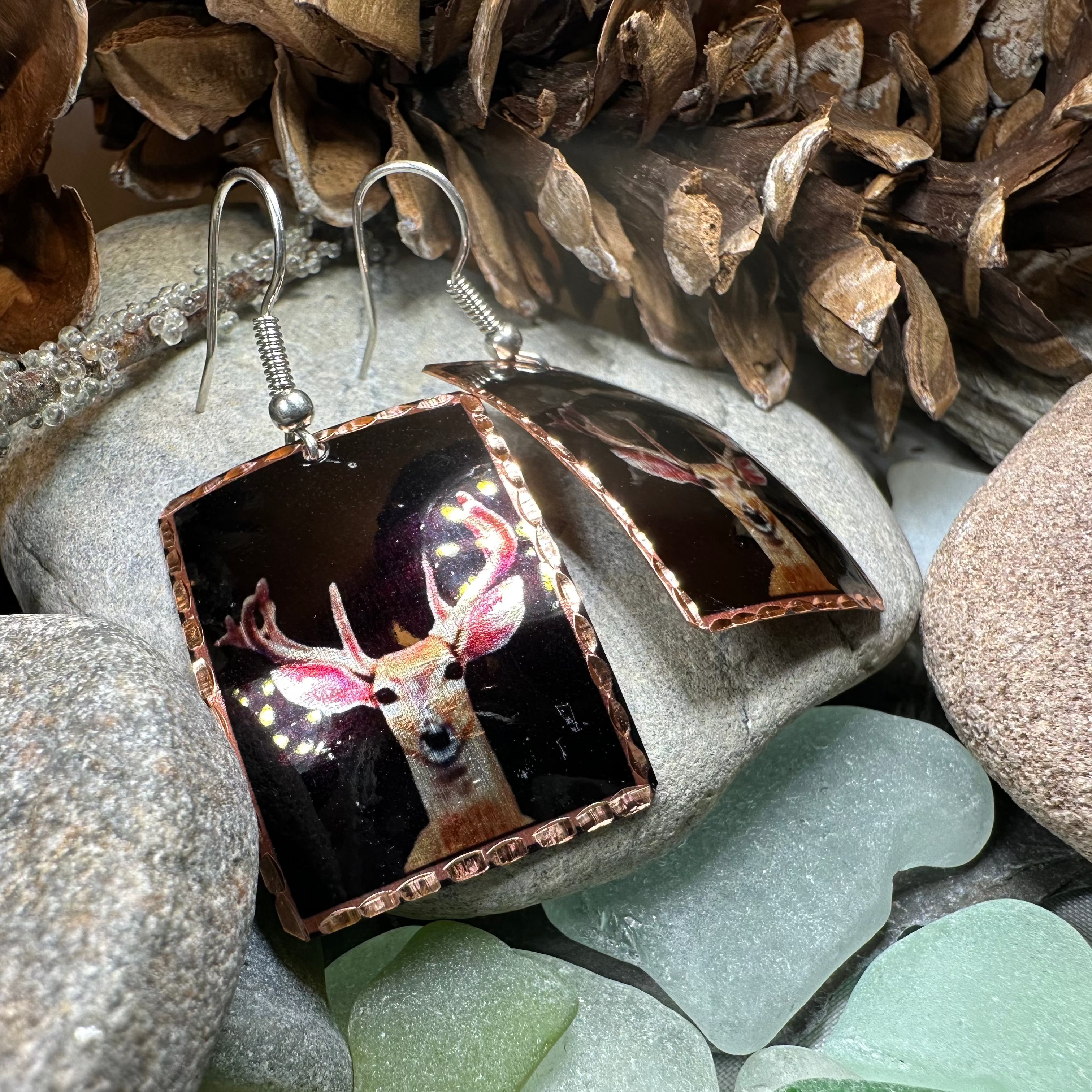Highland Stag Copper Dangle Earrings by Celtic Crystal Design Jewelry, featuring intricate stag design and handcrafted copper craftsmanship.