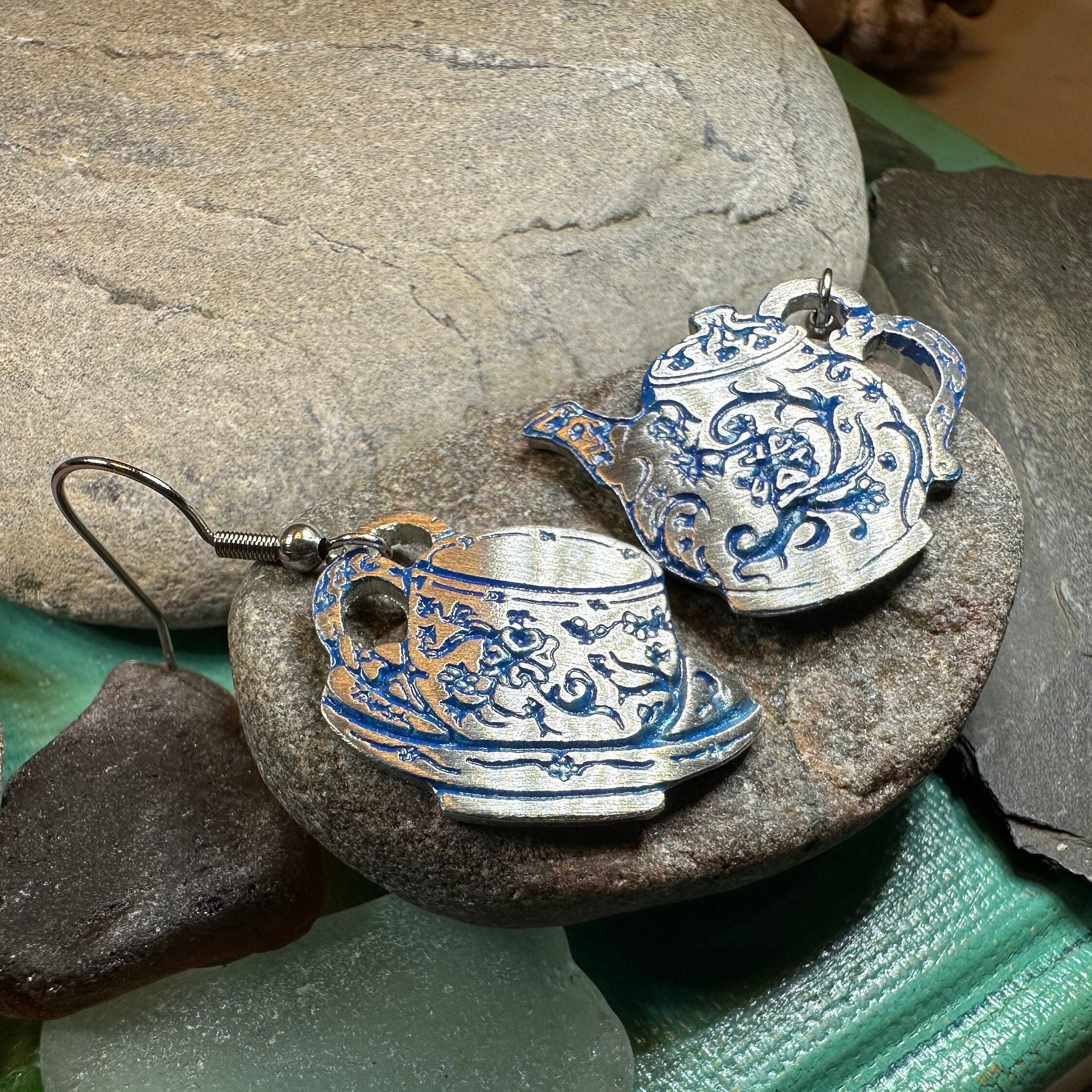 Celtic Crystal Design Jewelry old-fashioned teapot and cup dangle earrings with intricate details on silver-toned metal.