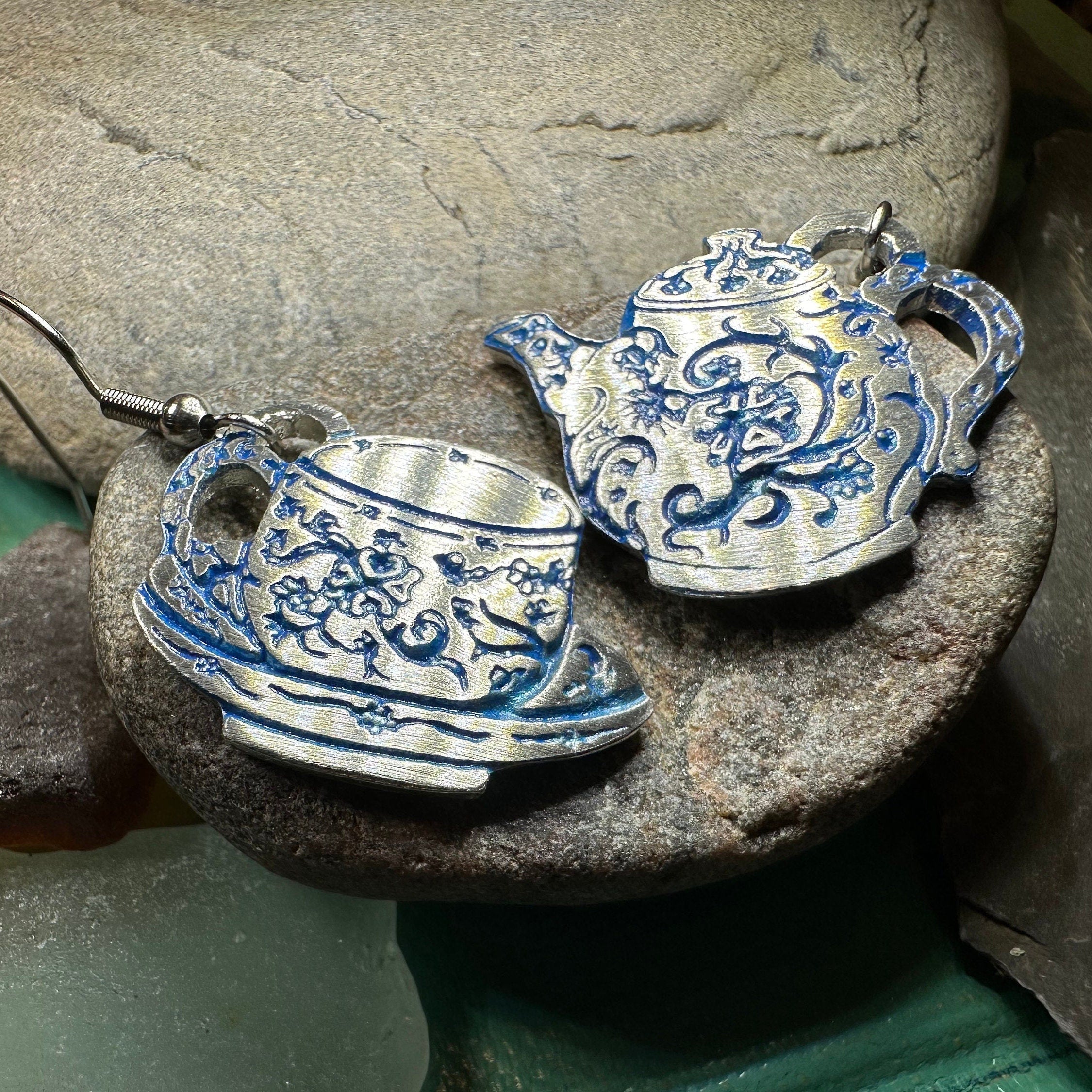 Celtic Crystal Design Jewelry dangle earrings featuring old-fashioned teapot and cup charms, intricate metalwork and sparkling accents.