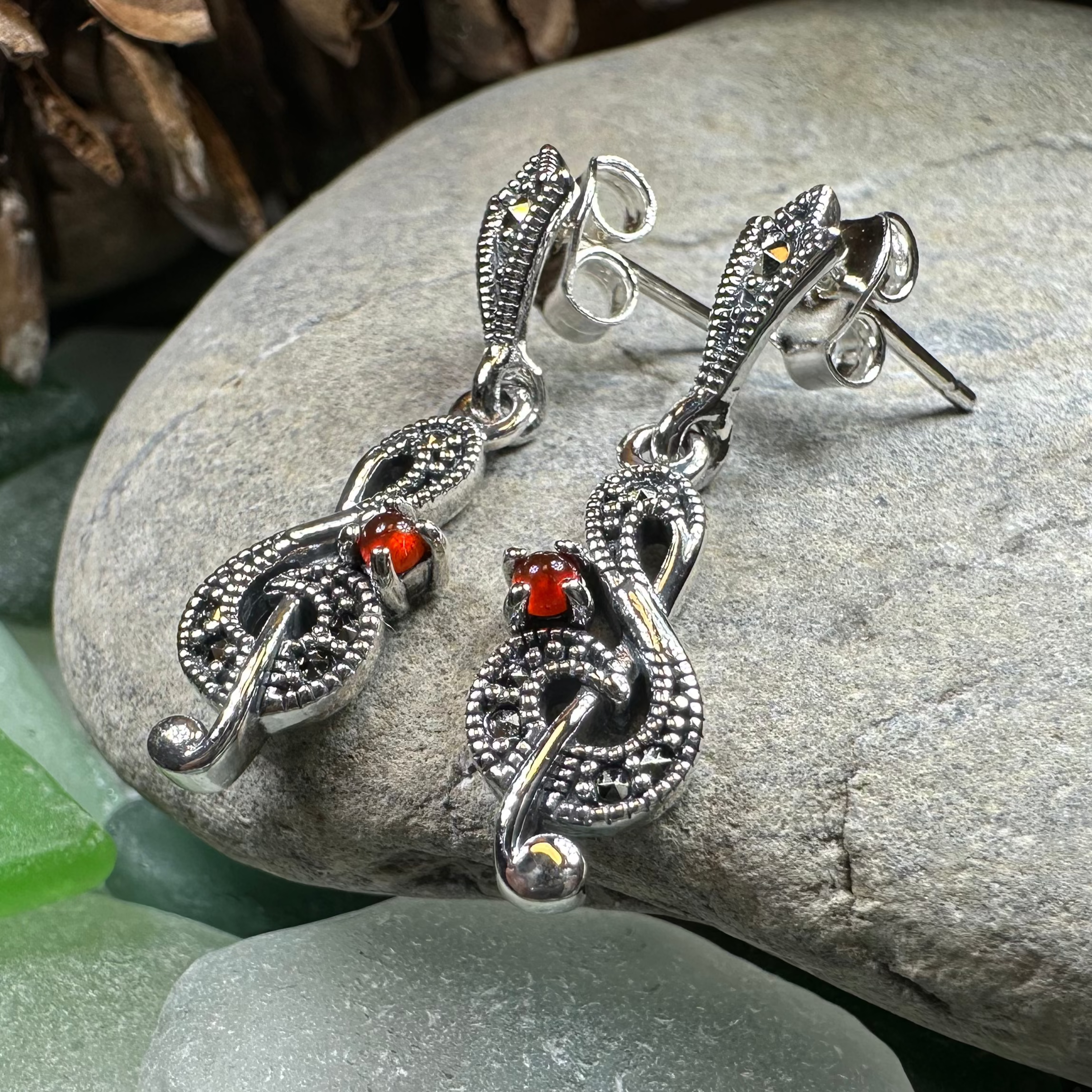 Celtic Crystal Design Jewelry Rhapsody music note dangle earrings featuring silver-tone musical note charms with intricate detailing.