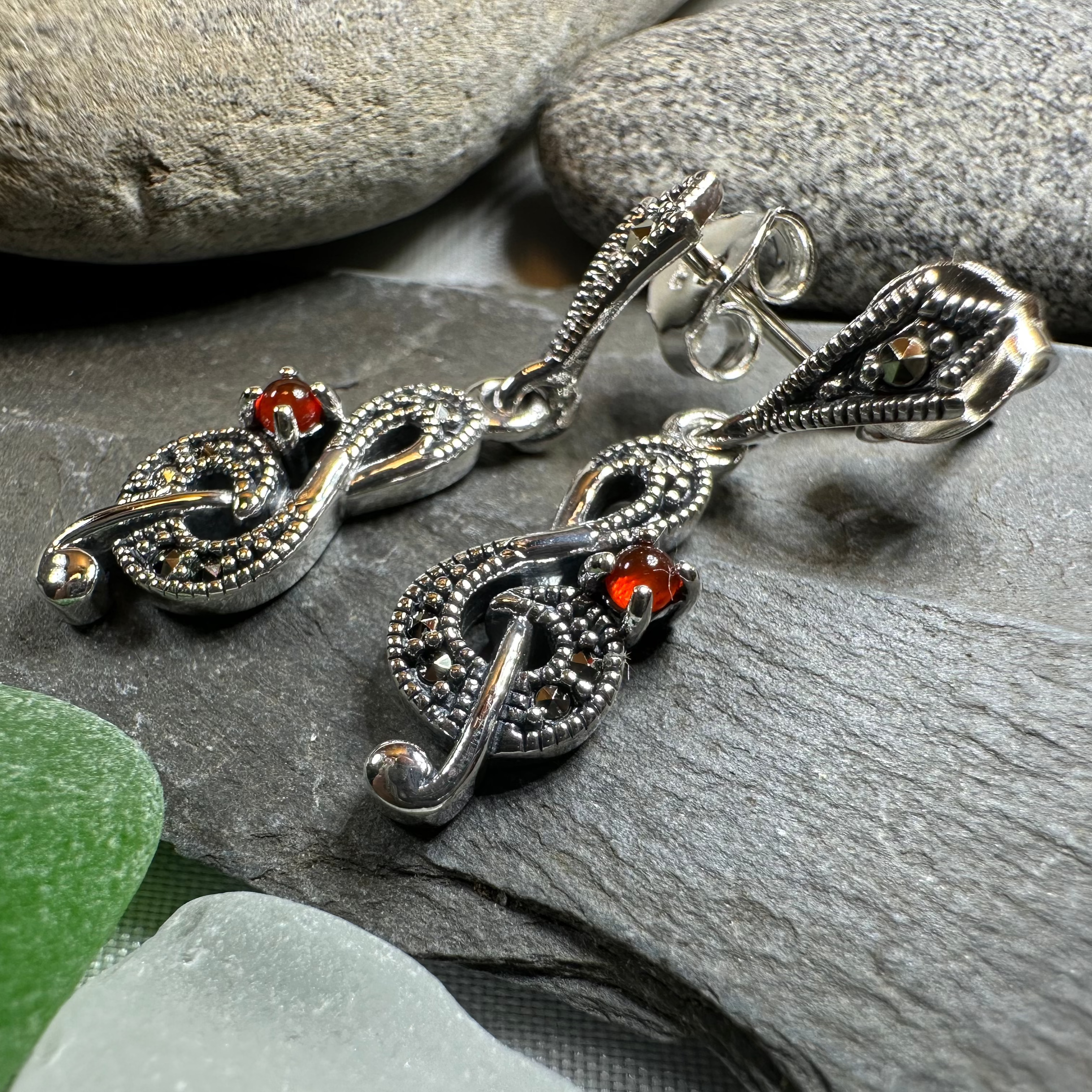 Celtic Crystal Design Jewelry Rhapsody music note dangle earrings with intricate metalwork and sparkling crystal accents.
