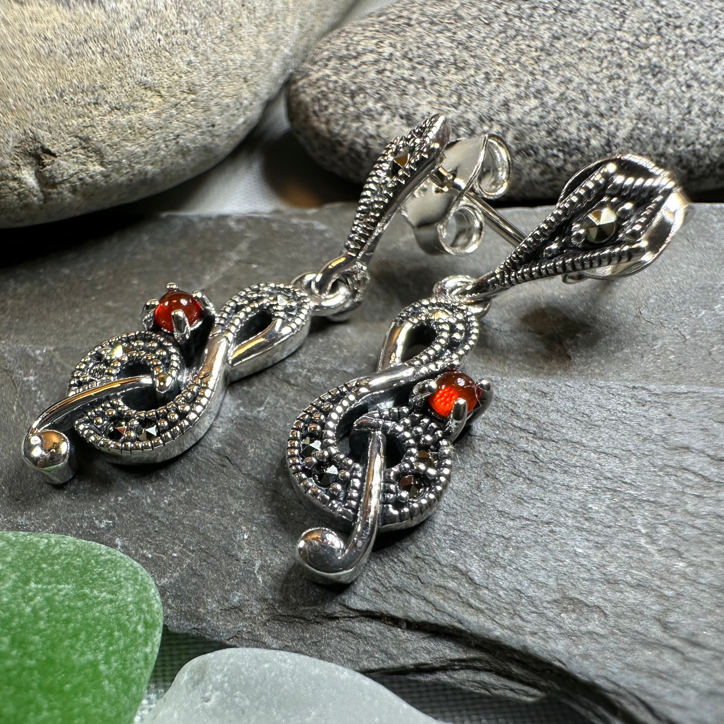 Celtic Crystal Design Jewelry Rhapsody music note dangle earrings featuring intricate silver-tone musical note charms.