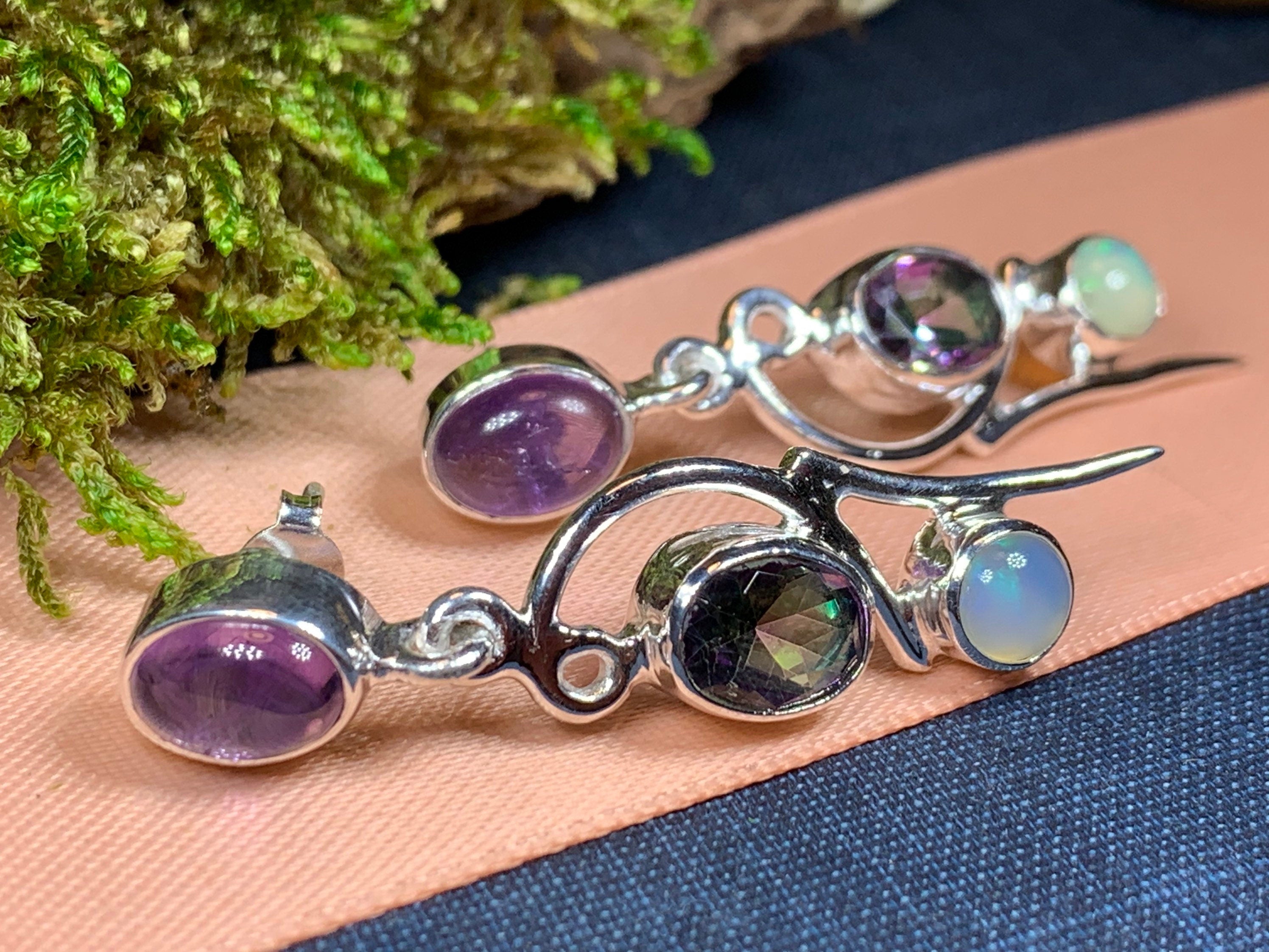 Dangle Celtic Crystal Design Jewelry earrings with Mystic Topaz stones and fairy waterfall design, showcasing intricate craftsmanship.