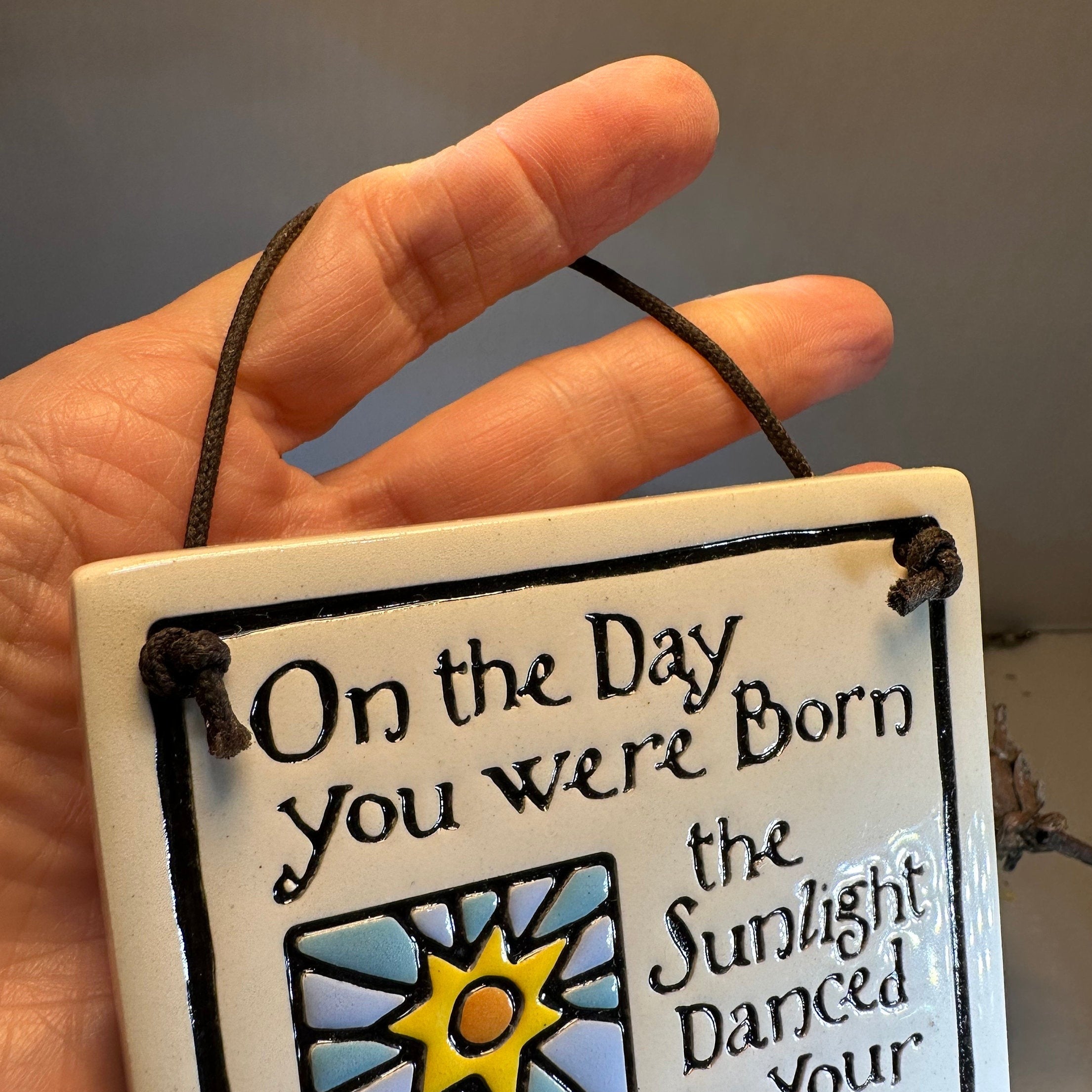 Colorful ceramic wall art with birthday-themed Celtic crystal design, perfect as a gift for celebrating special occasions.