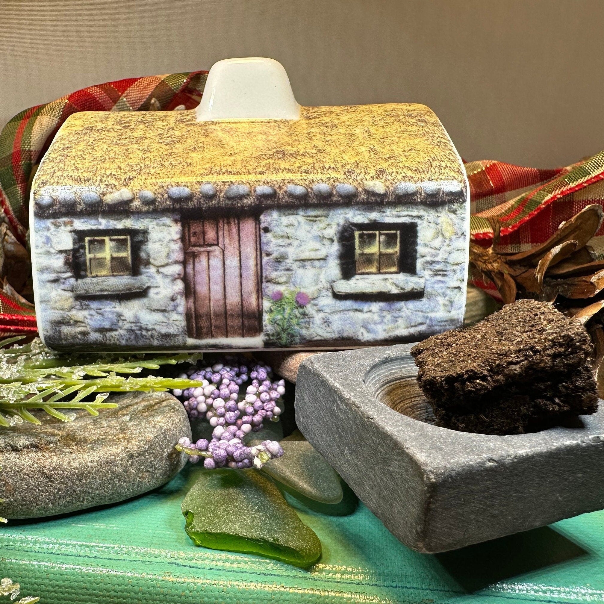 Scottish Cottage Turf Incense Burner from Celtic Crystal Design Jewelry, featuring a detailed miniature cottage for decorative gift use.