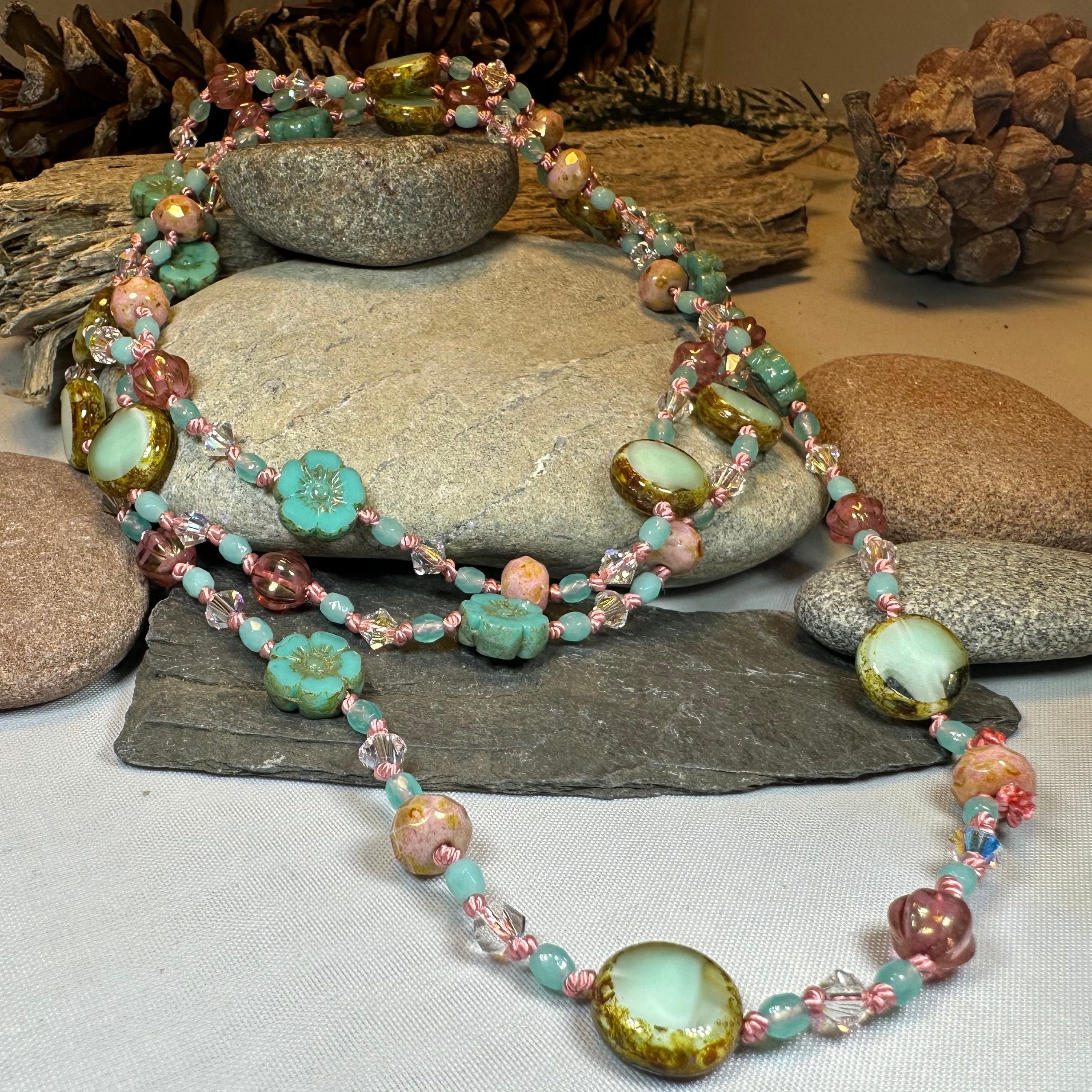 Pink Beach Blossom long necklace, Celtic Crystal Design Jewelry, elegant necklet with floral pink accents and intricate craftsmanship.