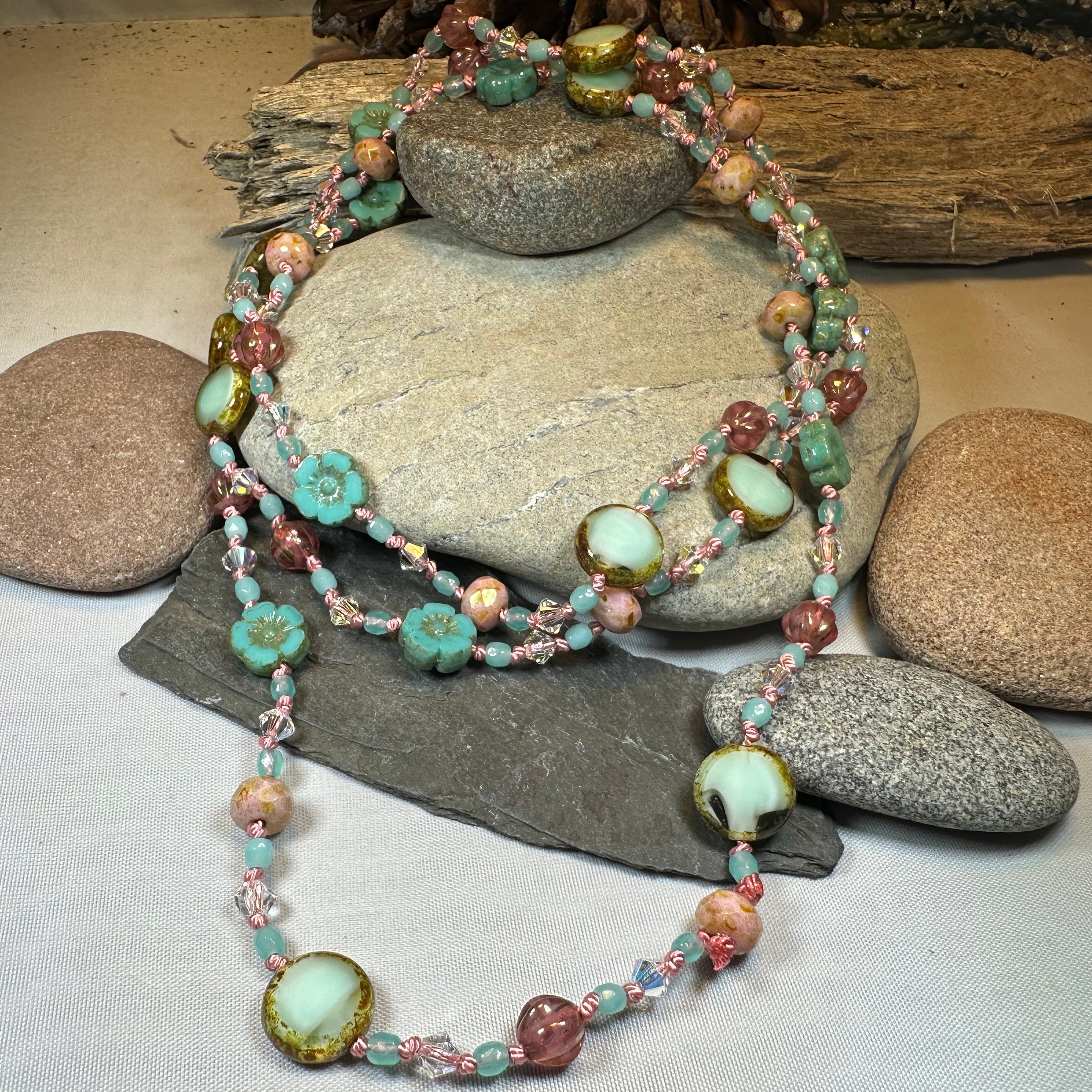 Pink Beach Blossom long necklace from Celtic Crystal Design Jewelry, featuring delicate beadwork and a floral-inspired pendant.