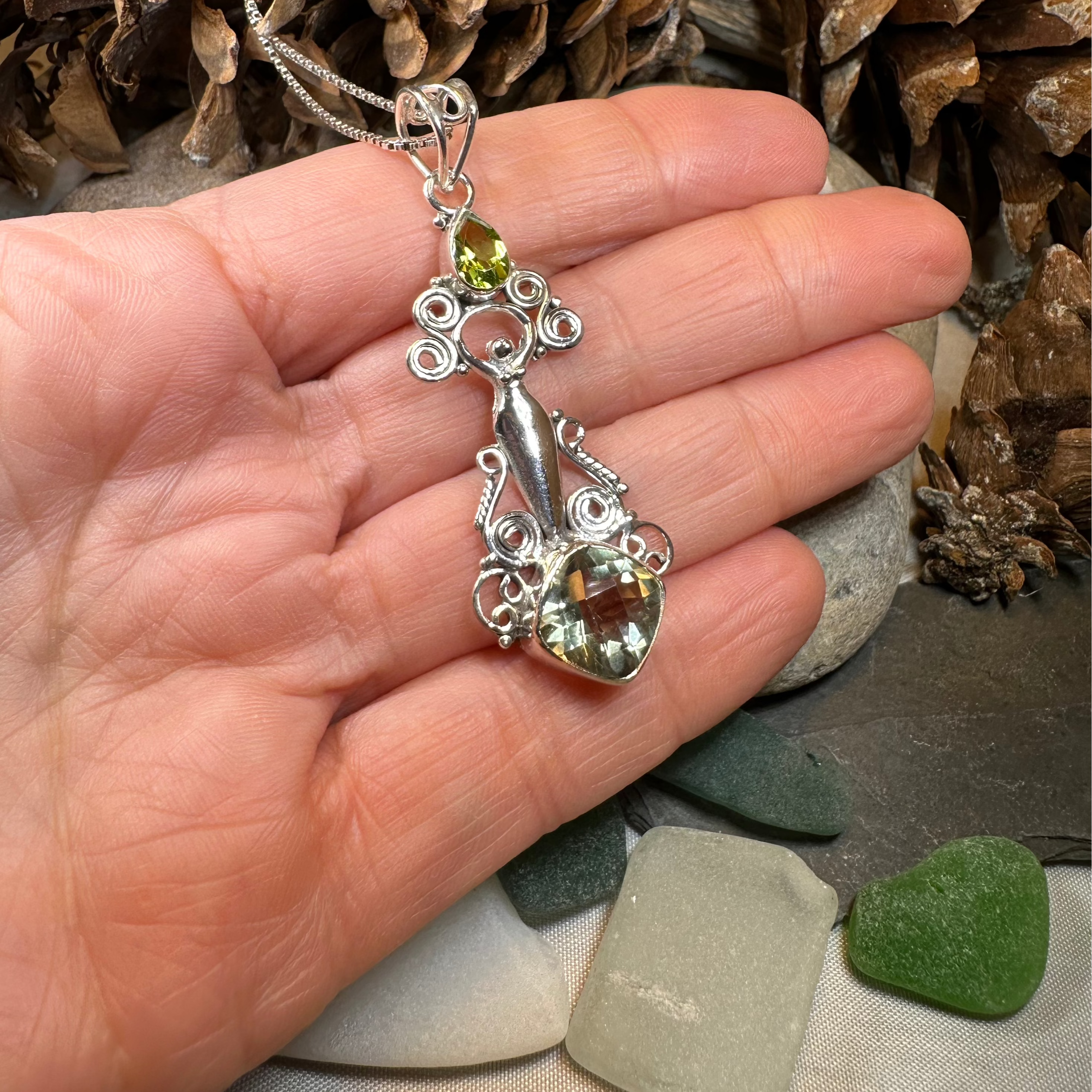 Celtic Crystal Design Jewelry Rising Goddess pendant necklace with oval citrine gemstone, intricate Celtic-inspired design.