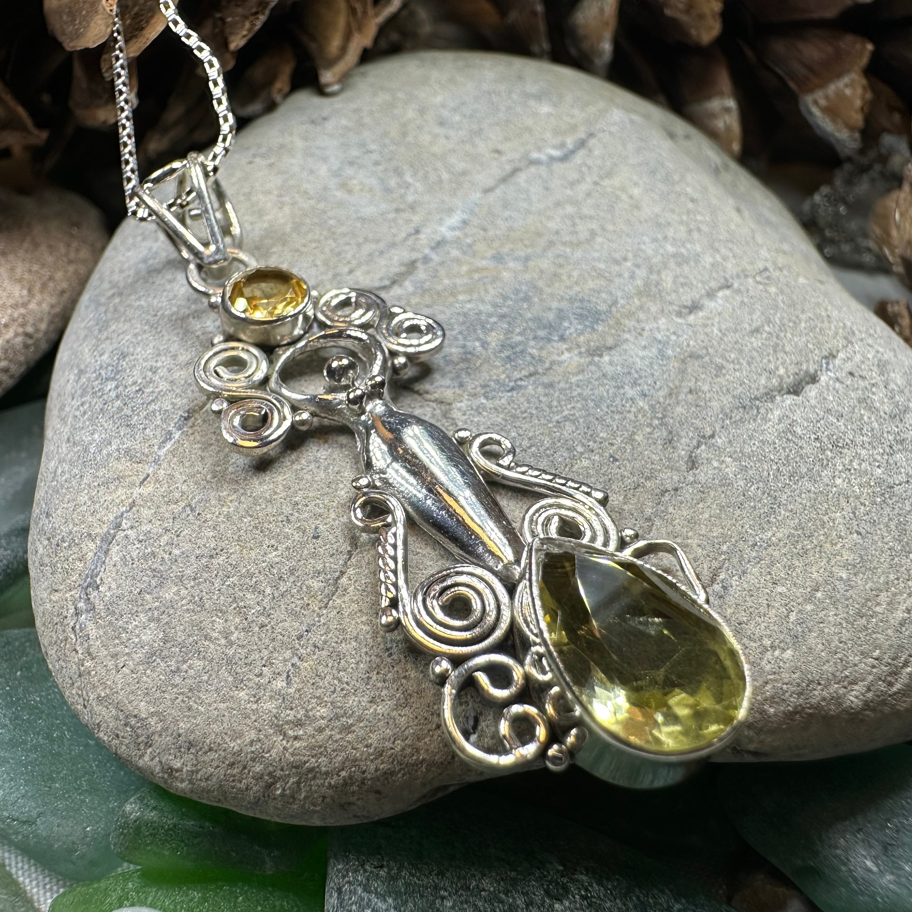 Celtic Crystal Design Jewelry Rising Goddess Pendant necklace with an oval citrine gemstone. Elegant jewelry piece.