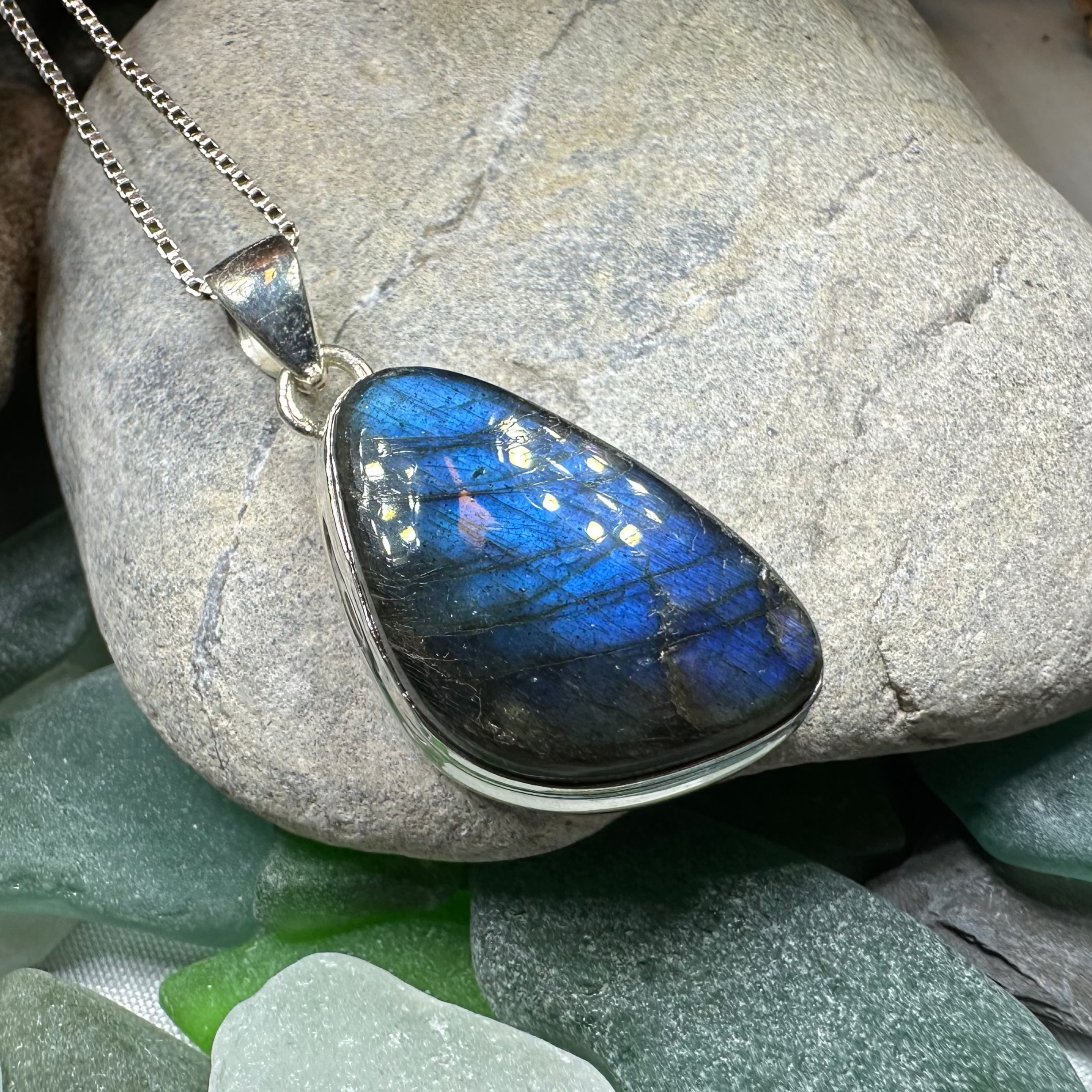 Galaxy blue Labradorite pendant necklace by Celtic Crystal Design Jewelry featuring an eye-catching large gemstone.