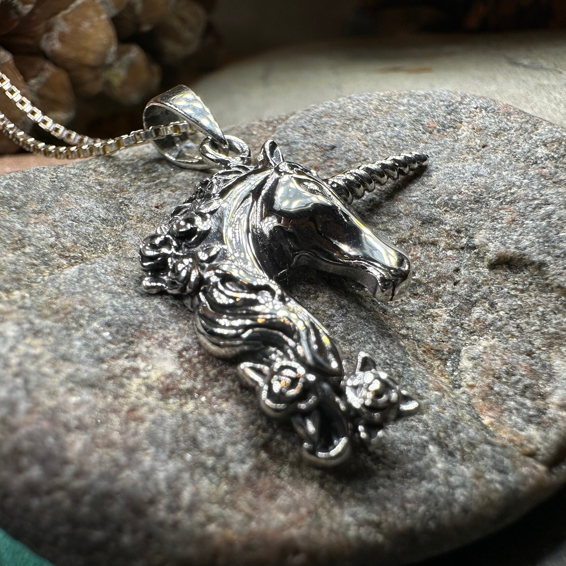 Celtic Crystal Design Jewelry Gwenllian Unicorn Necklace pendant featuring a detailed unicorn design on a silver chain.