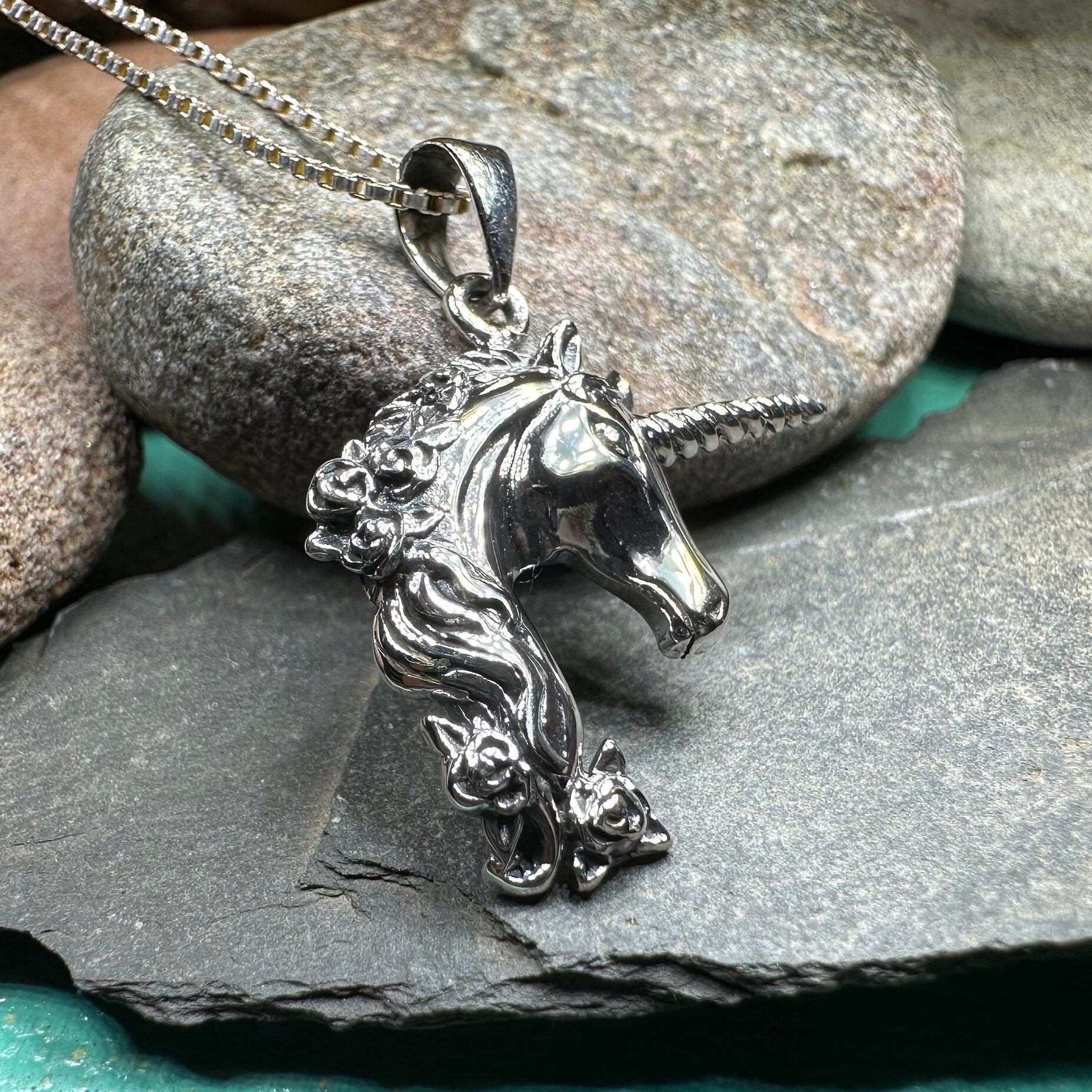 Celtic Crystal Design Jewelry Gwenllian Unicorn Necklace pendant featuring a detailed unicorn design on a silver chain.