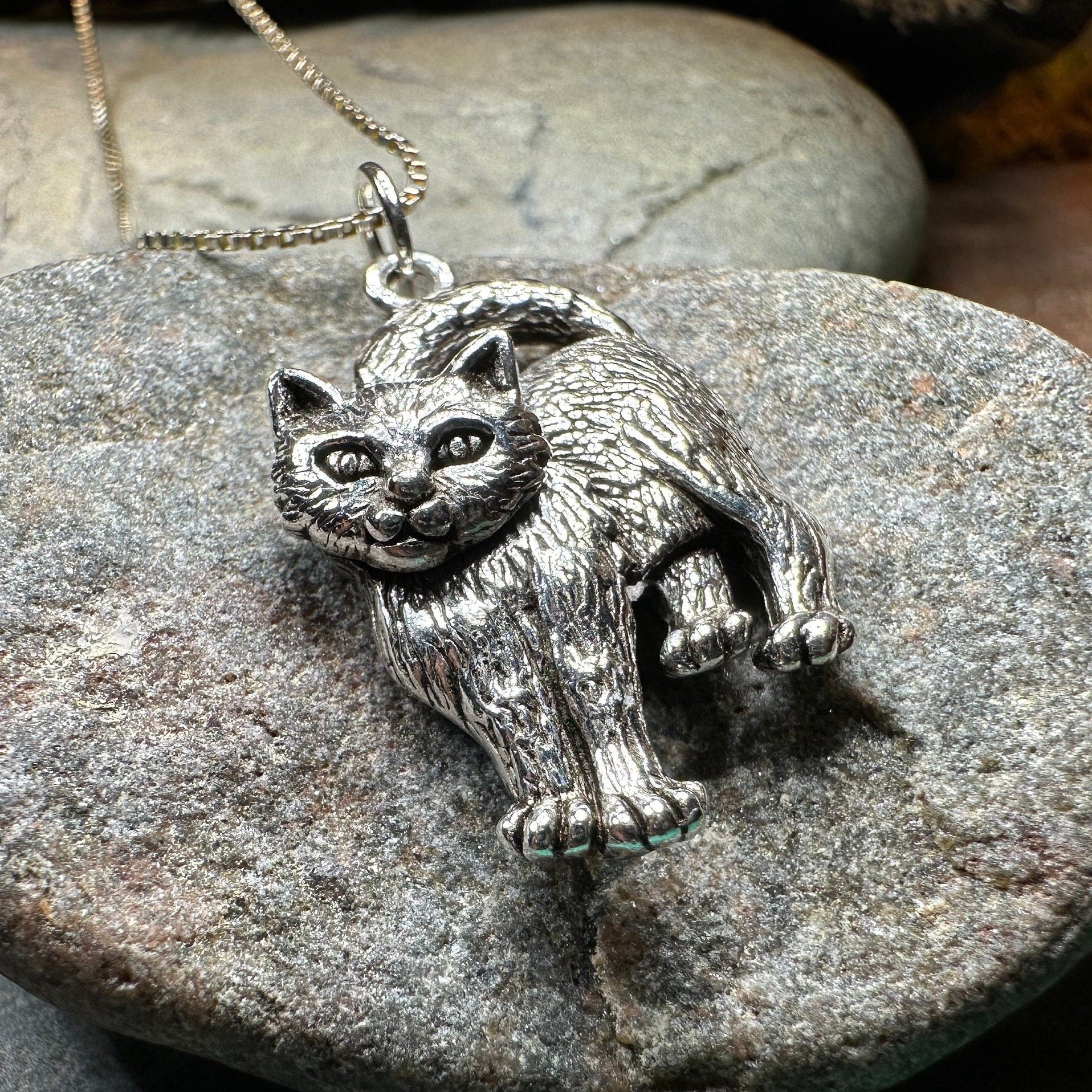 Josie Cat pendant necklace by Celtic Crystal Design Jewelry featuring a detailed feline-shaped charm on a silver chain.
