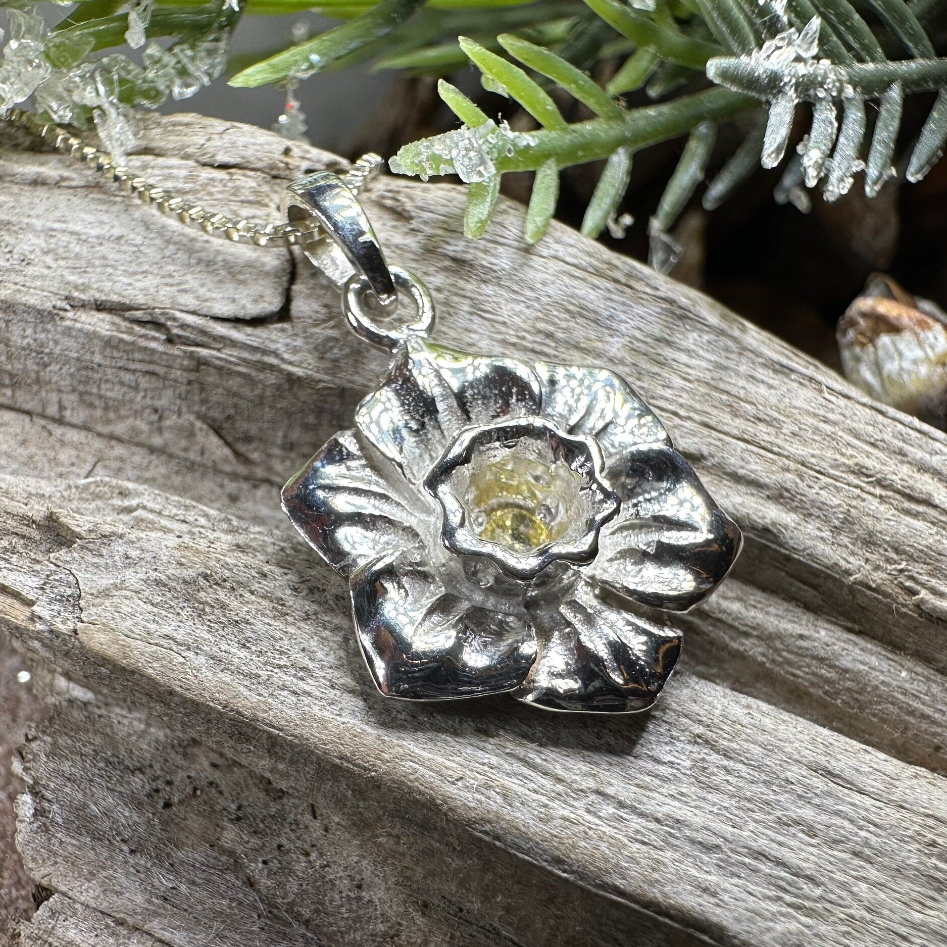 Welsh Daffodil pendant necklace by Celtic Crystal Design Jewelry, featuring a detailed floral charm on a silver chain.