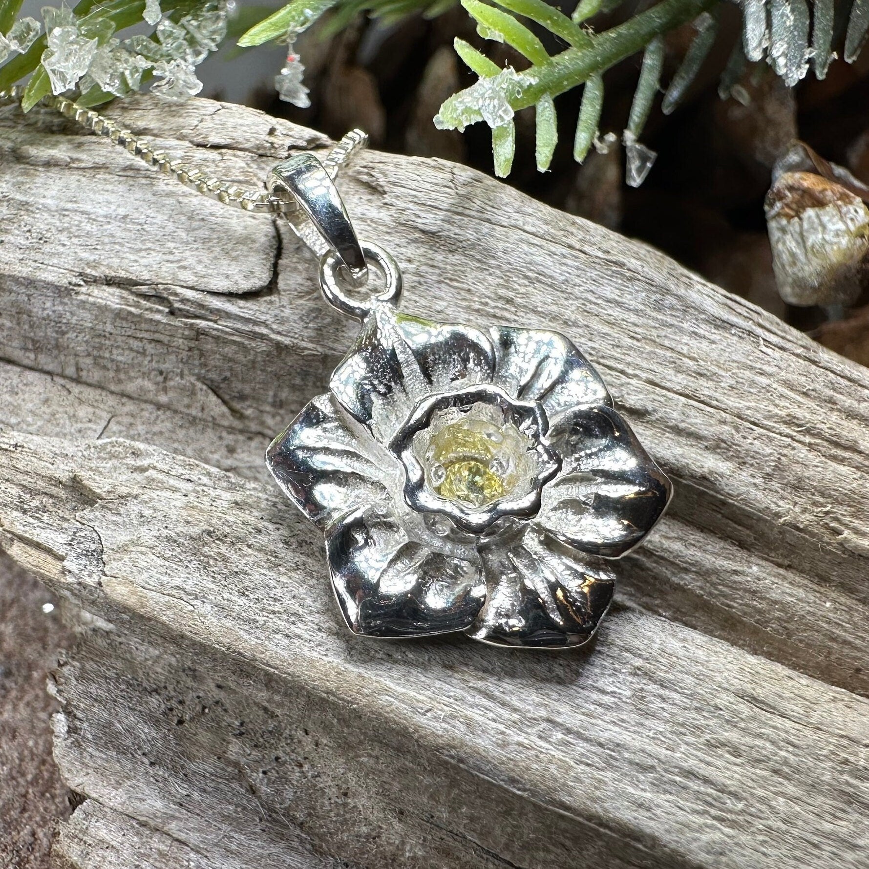 Celtic Crystal Design Jewelry Welsh Daffodil pendant necklace featuring a detailed floral Celtic motif on a silver chain.