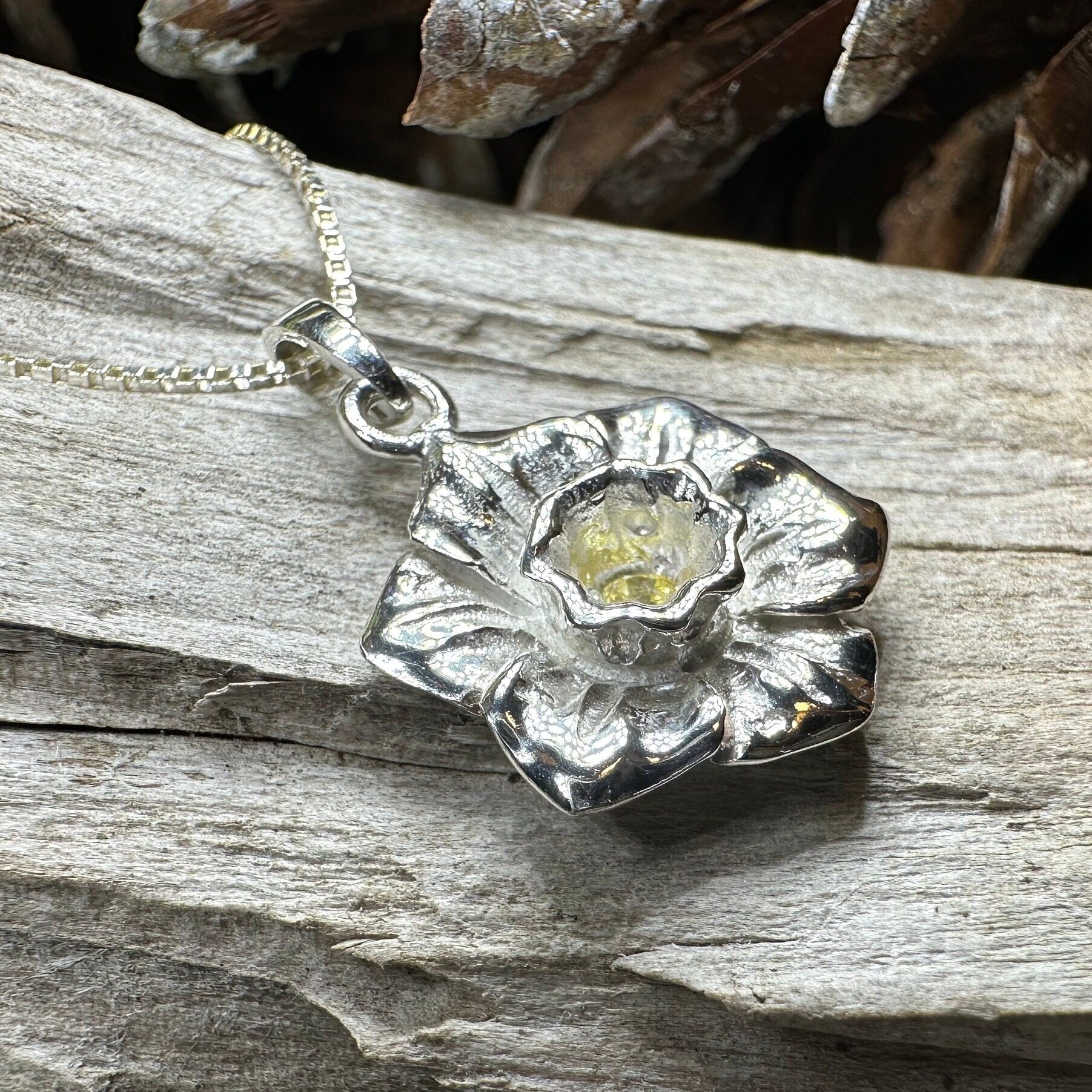 Celtic Crystal Design Jewelry Welsh Daffodil pendant necklace featuring a detailed floral Celtic motif in silver.