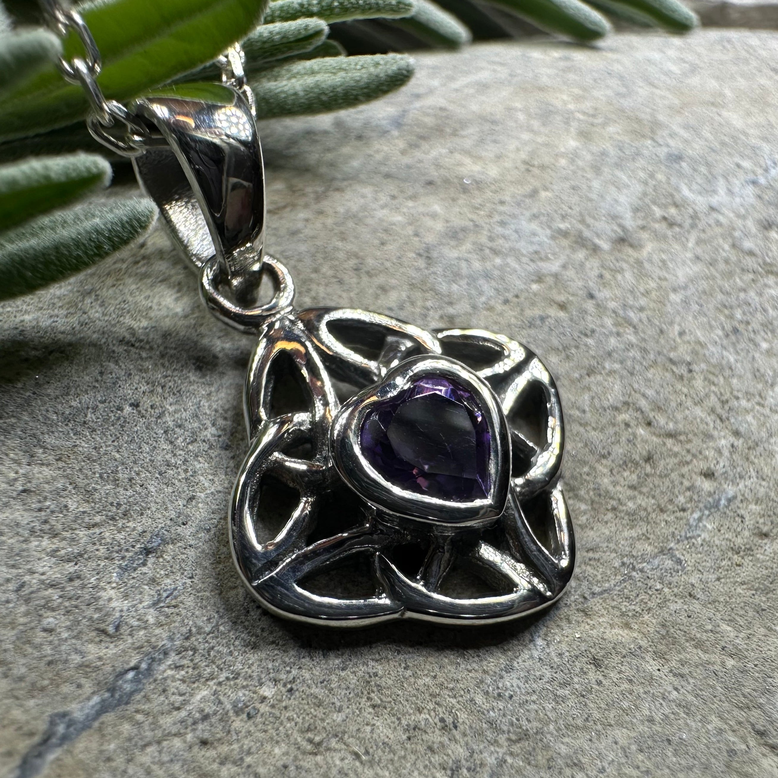 Amethyst Celtic Knot pendant necklace by Celtic Crystal Design Jewelry featuring a detailed Celtic knot design and purple gemstone.