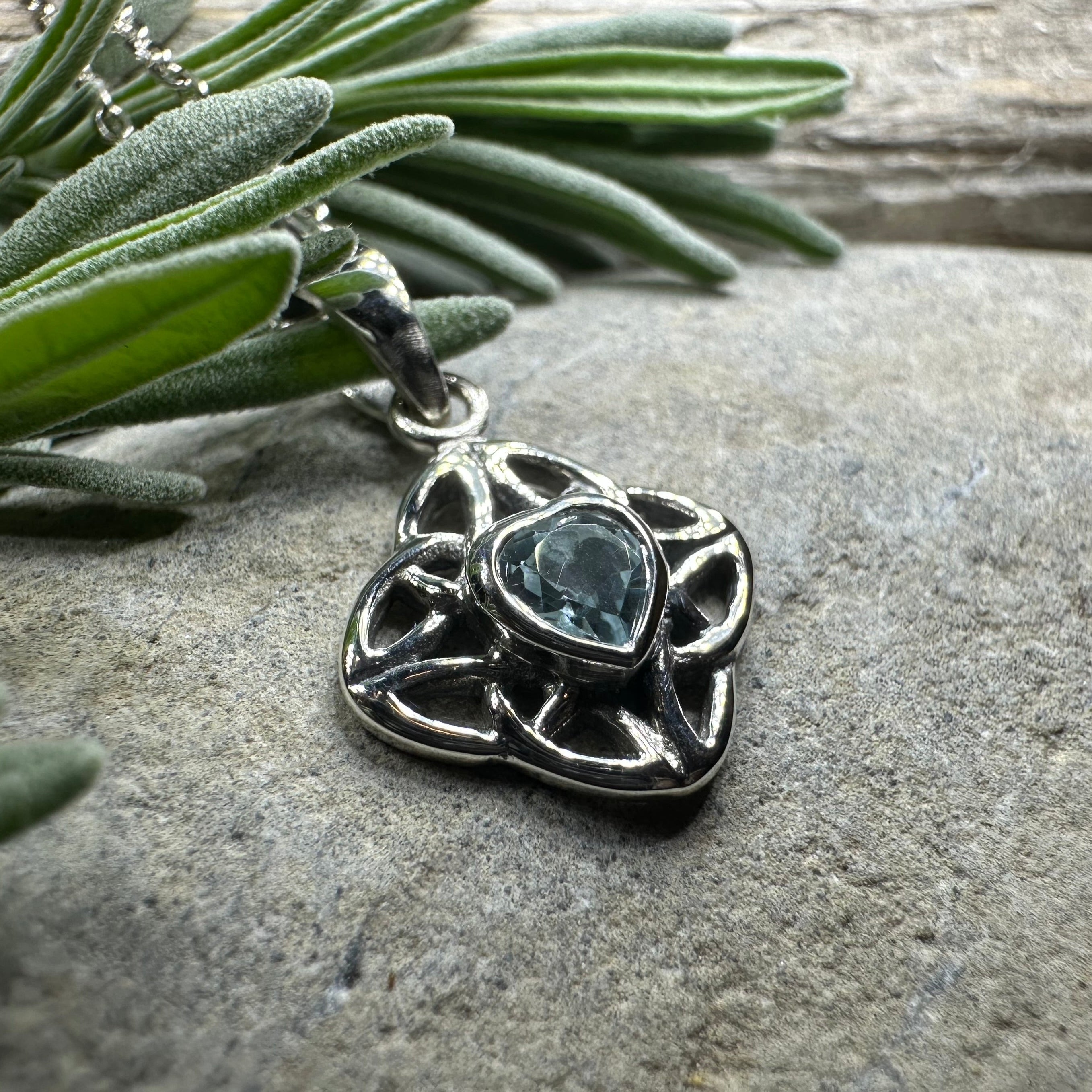 Amethyst Celtic knot pendant necklace by Celtic Crystal Design Jewelry featuring intricate Celtic knot design and purple gemstone.
