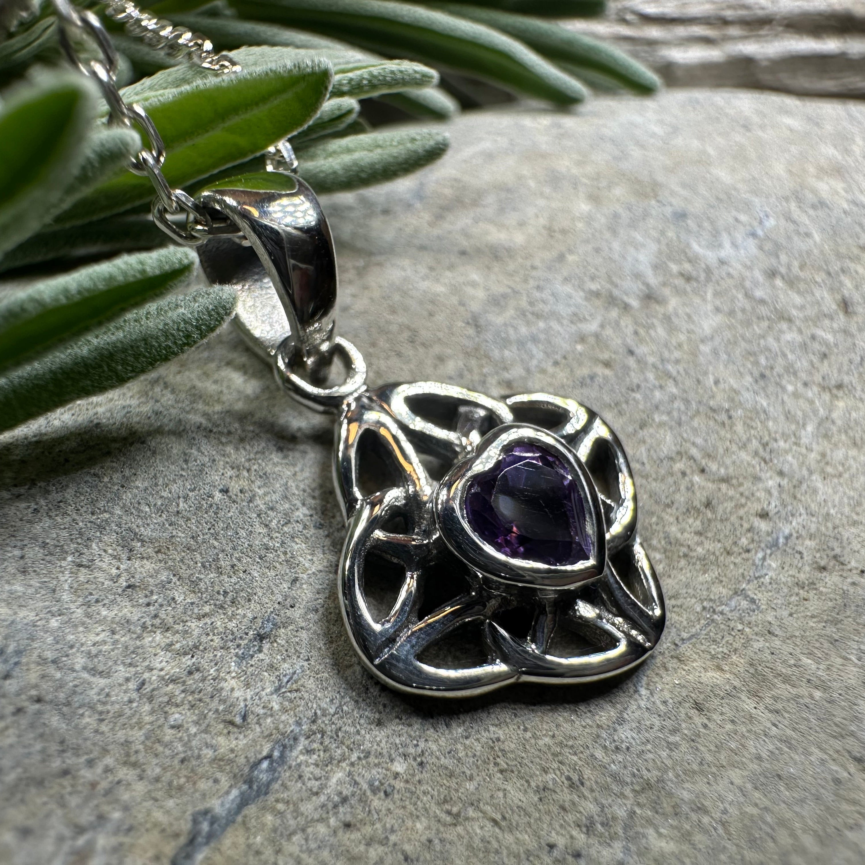 Amethyst Celtic Knot pendant necklace by Celtic Crystal Design Jewelry featuring intricate Celtic knot design and purple gemstone.
