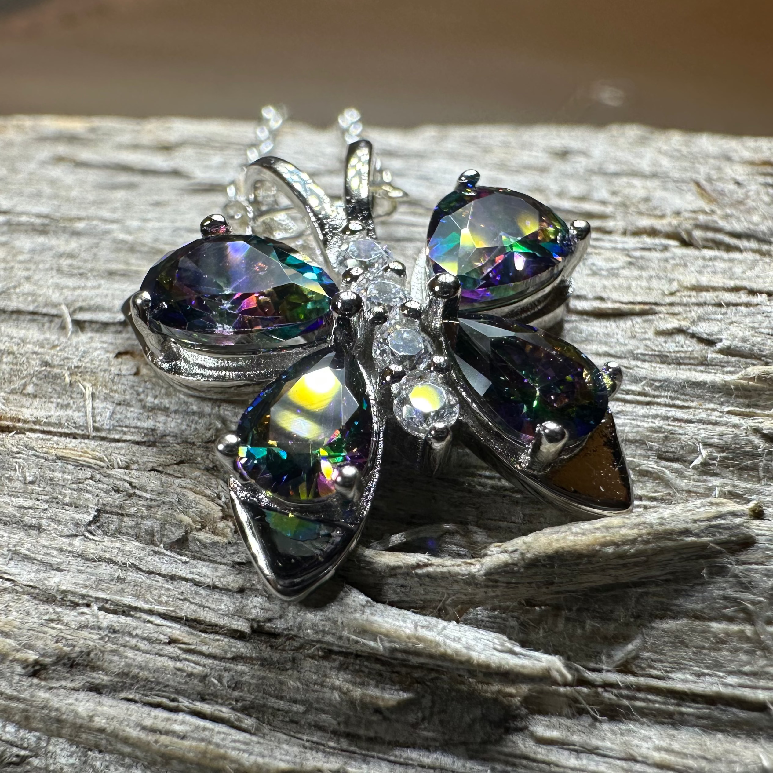 Celtic Crystal Design Jewelry Mystic Topaz butterfly pendant necklace with intricate metalwork and sparkling gemstone.