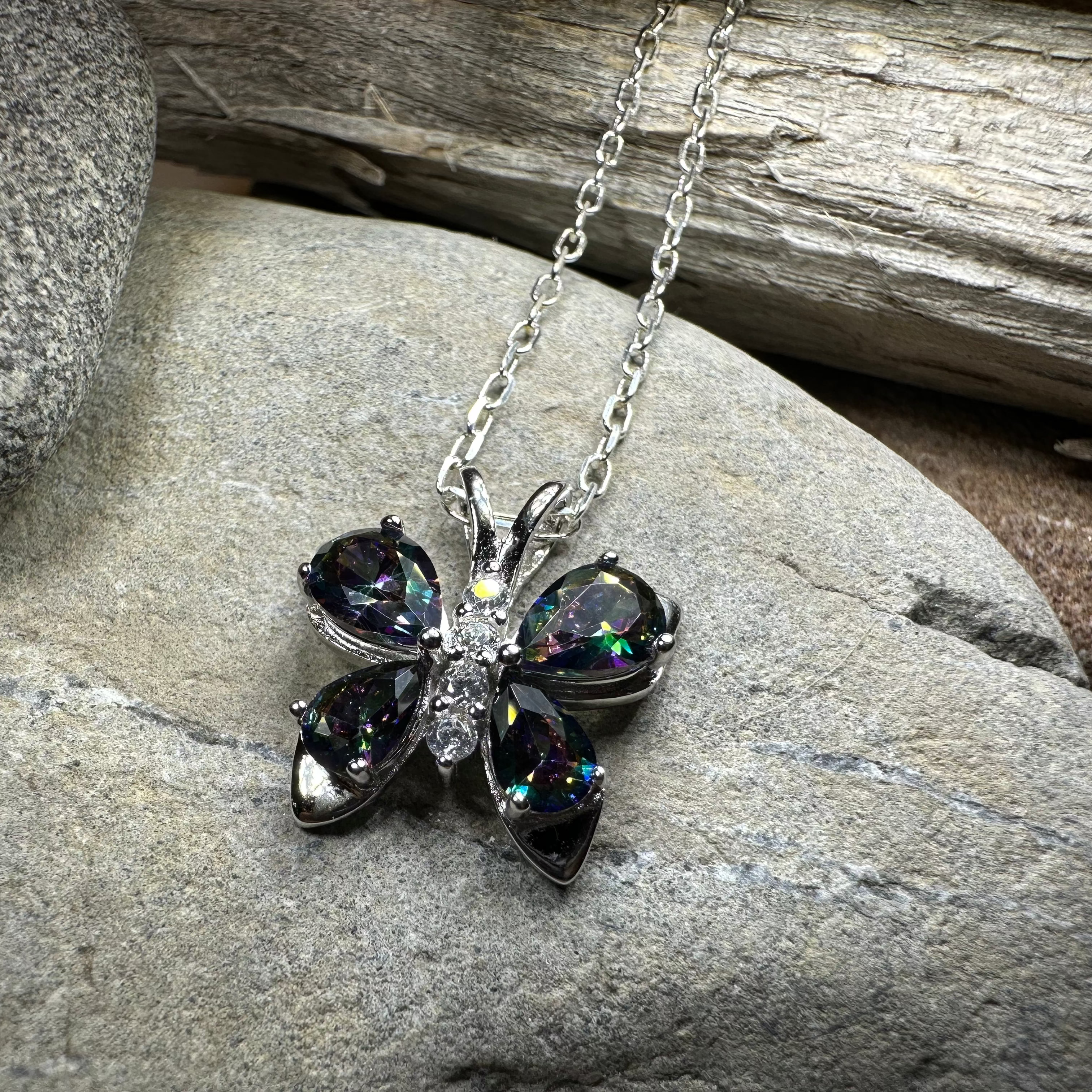 Celtic Crystal Design Jewelry Mystic Topaz butterfly pendant necklace featuring a sparkling topaz gemstone and intricate metalwork.