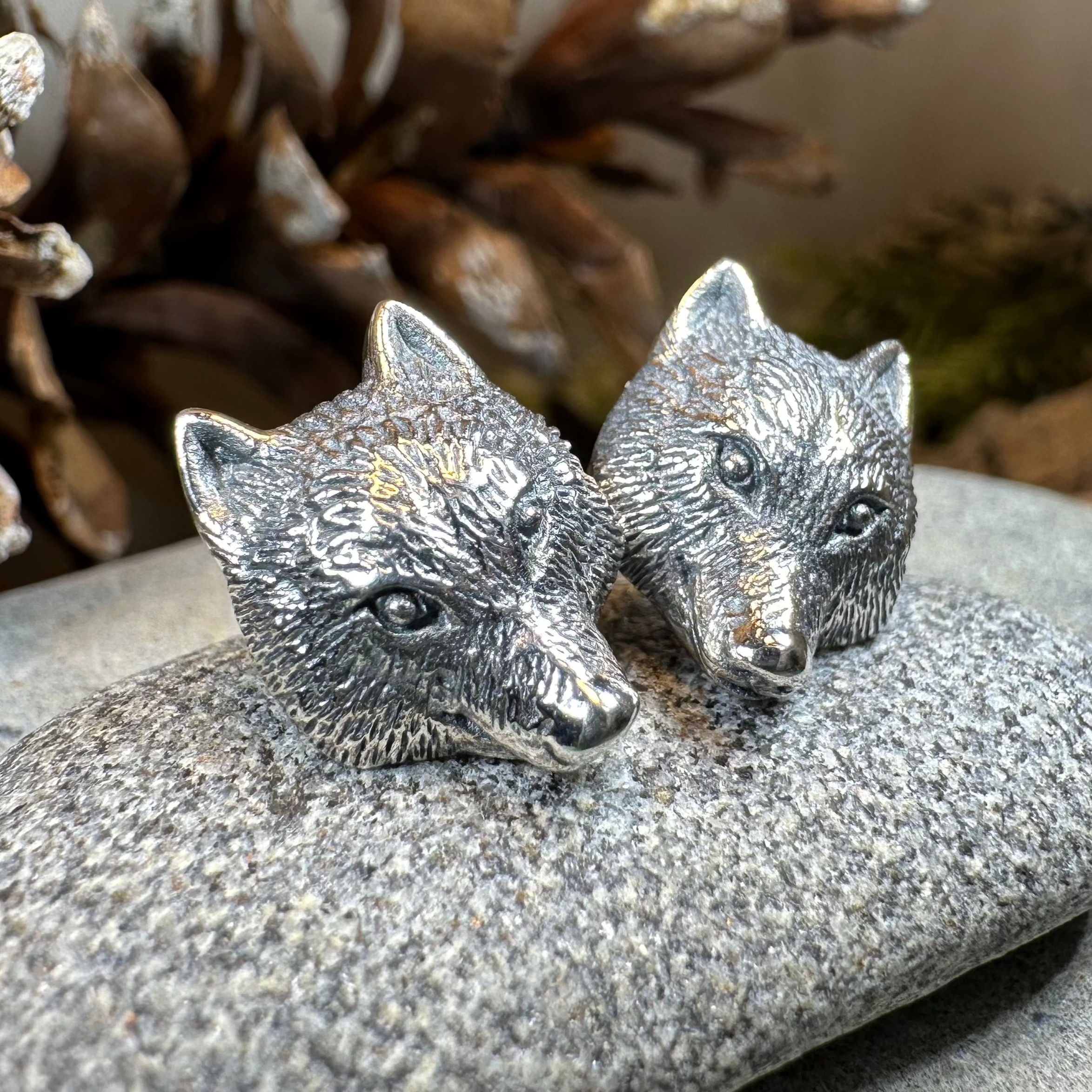 Forest Song Wolf Post Earrings by Celtic Crystal Design Jewelry featuring detailed wolf designs on silver-tone metal.