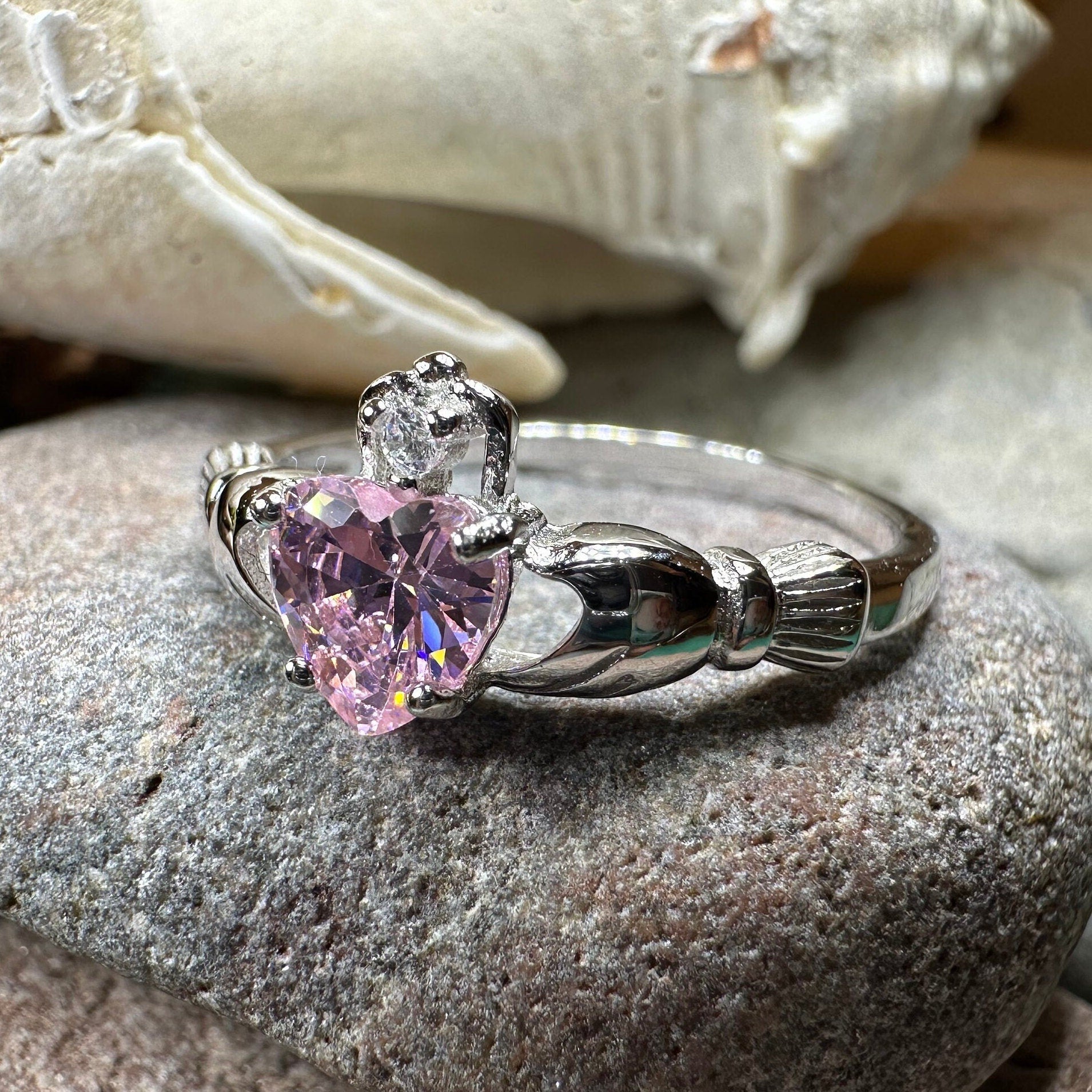 Light pink Petal Claddagh Ring by Celtic Crystal Design Jewelry, featuring intricate Celtic-inspired details and a delicate heart-shaped motif.