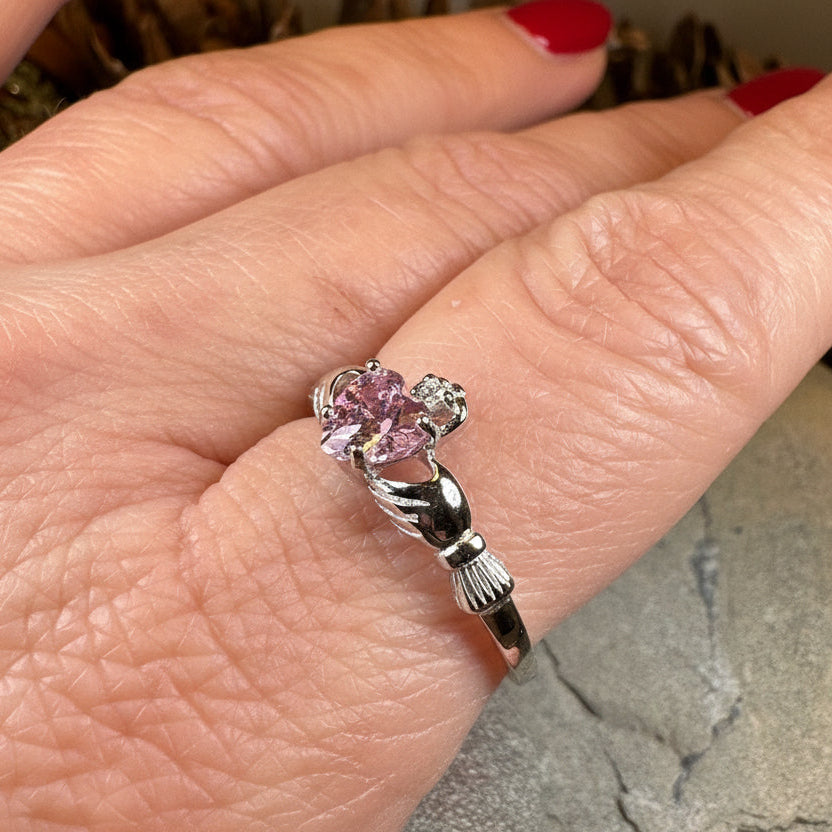 Petal pink Claddagh ring by Celtic Crystal Design Jewelry, featuring intricate Celtic motifs and a delicate pink gemstone accent.