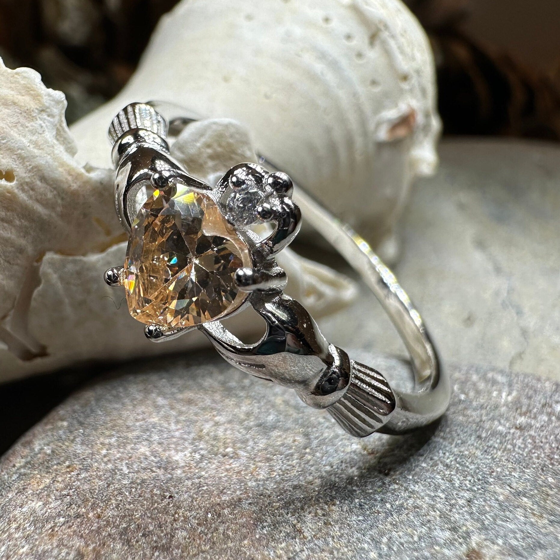 Celtic Crystal Design Jewelry Champagne Toast Claddagh Ring featuring intricate Celtic and Claddagh symbols in detailed silver finish.