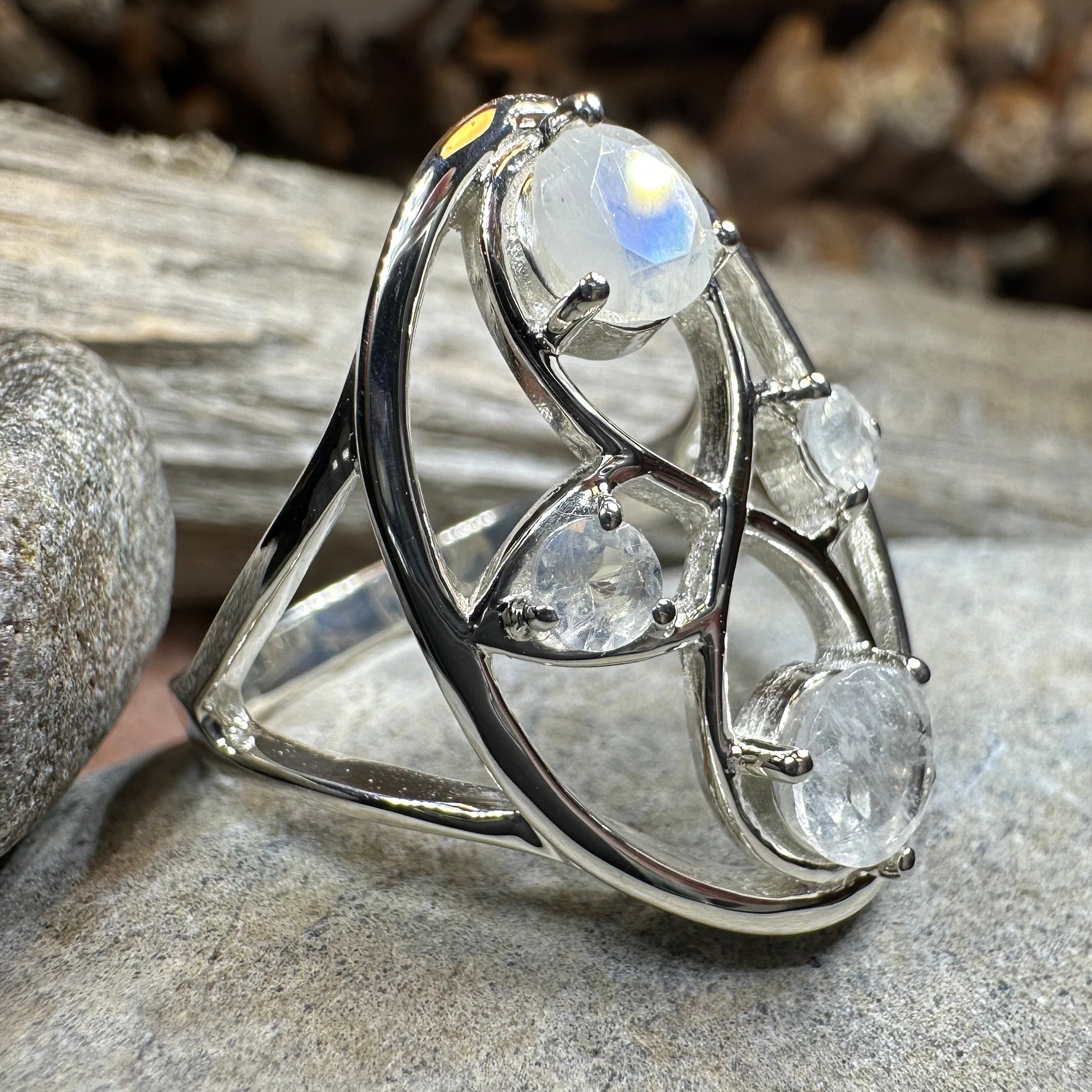 Celtic Crystal Design Jewelry moonstone infinity ring with intricate Celtic pattern and sparkling moonstone gemstone.