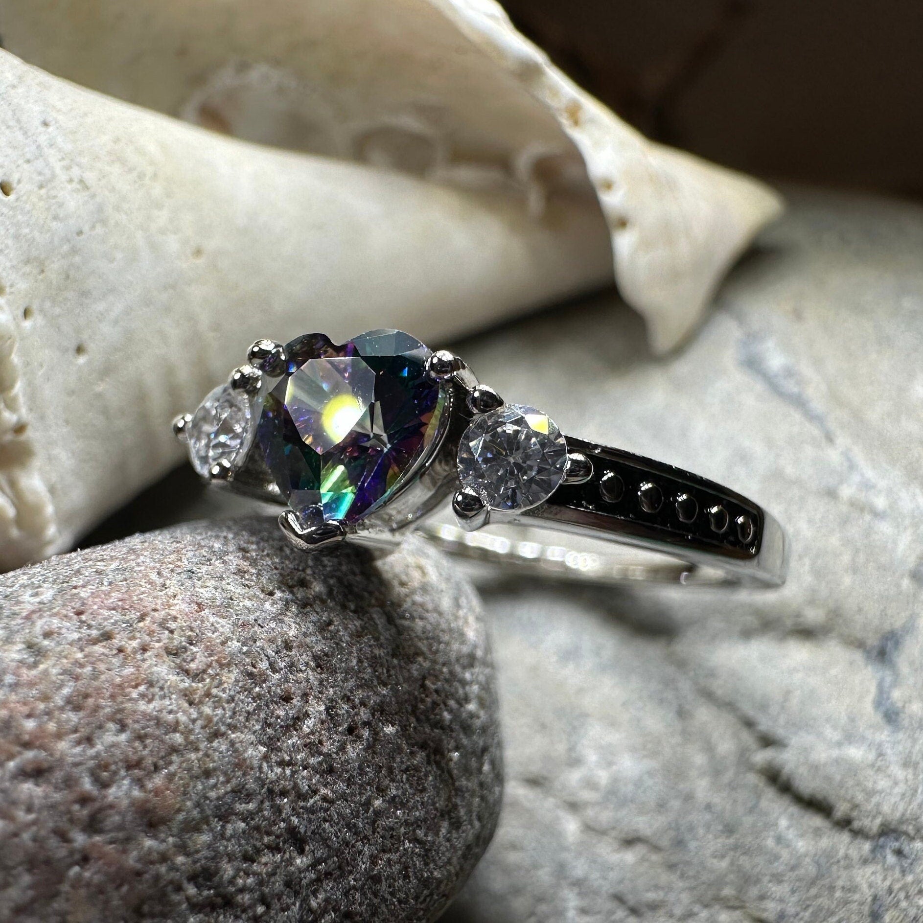 Celtic Crystal Design Jewelry Mystic Topaz Heart Ring showcasing a sparkling topaz gemstone in a detailed silver band.