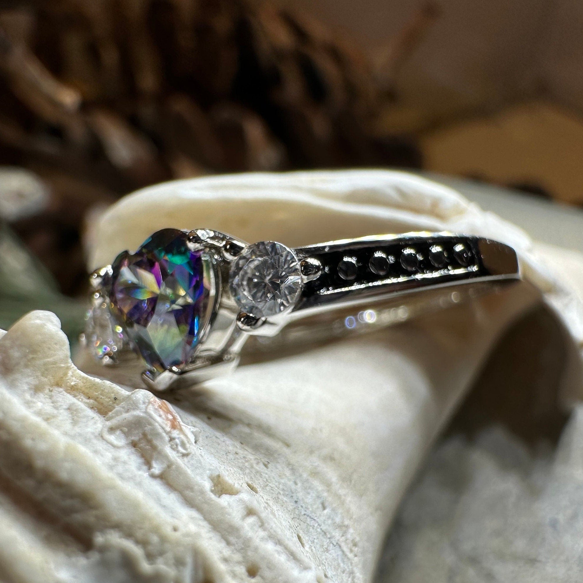 Celtic Crystal Design Jewelry Mystic Topaz Heart Ring showcasing a sparkling topaz gemstone set in a detailed silver band.