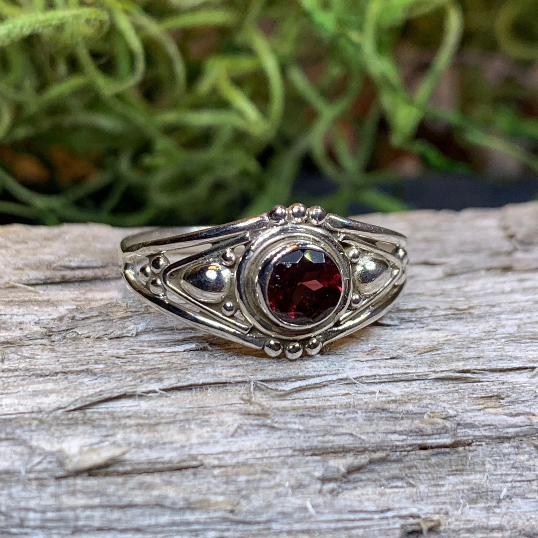 Klarina Celtic Ring by Celtic Crystal Design Jewelry featuring intricate Celtic knots and a central amethyst gemstone.