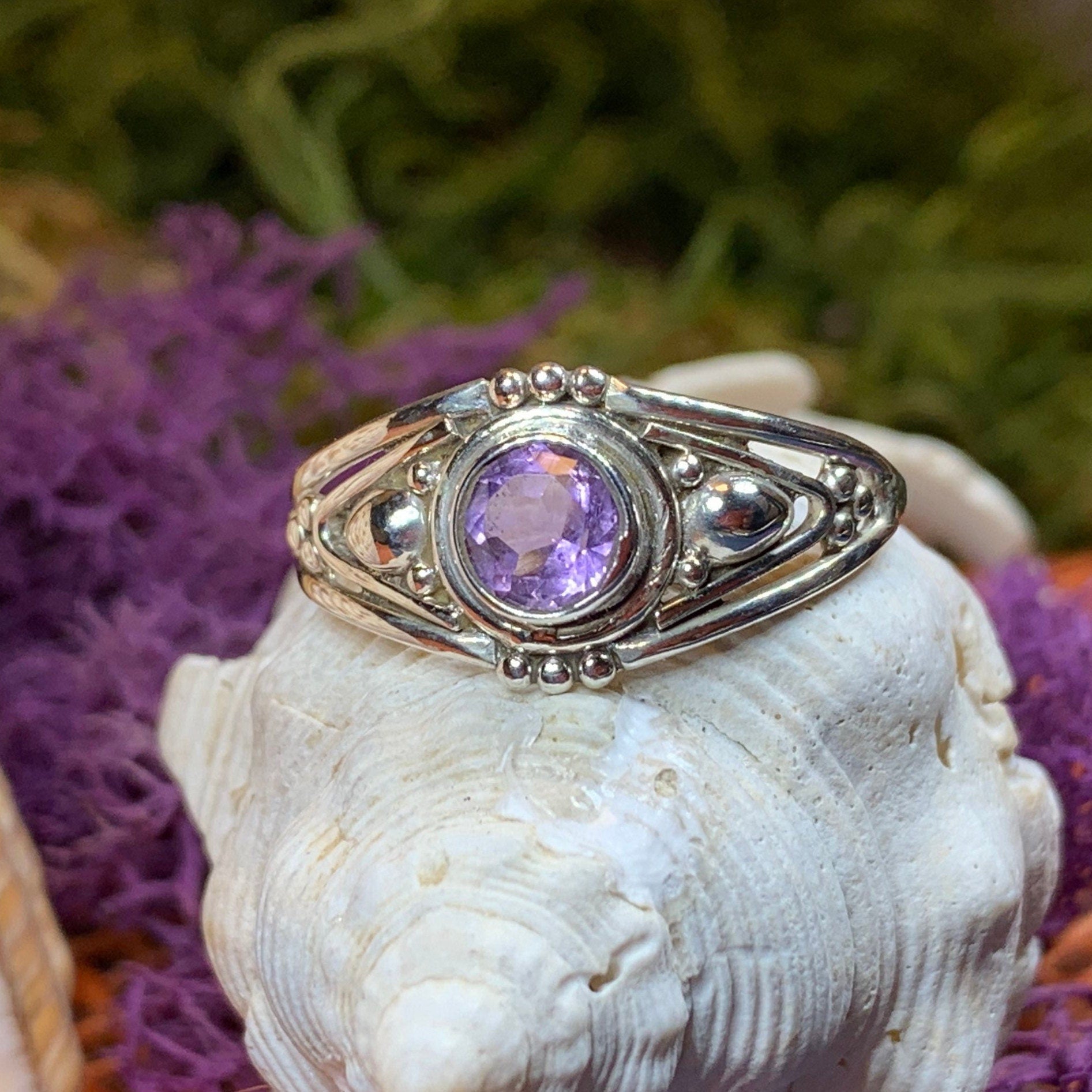 Klarina Celtic Ring by Celtic Crystal Design Jewelry featuring intricate Celtic patterns and a central amethyst gemstone.