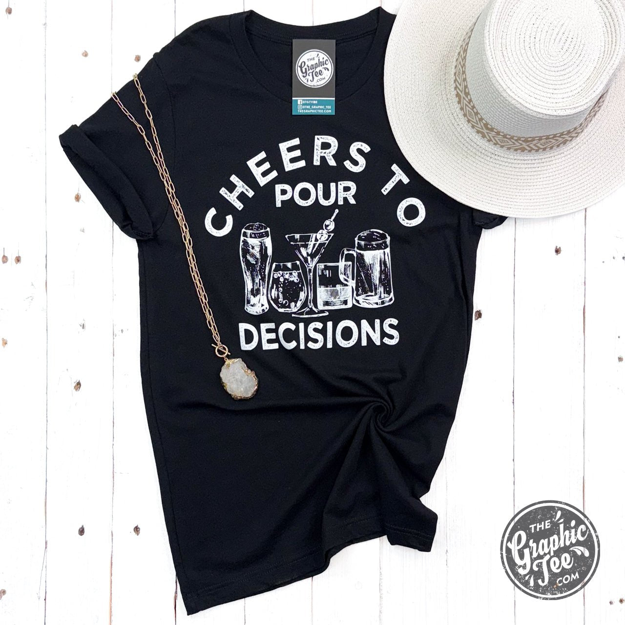 Cheerful Cheers to Pour Decisions short sleeve graphic T-shirt by The Graphic Tee with fun drink-themed design.