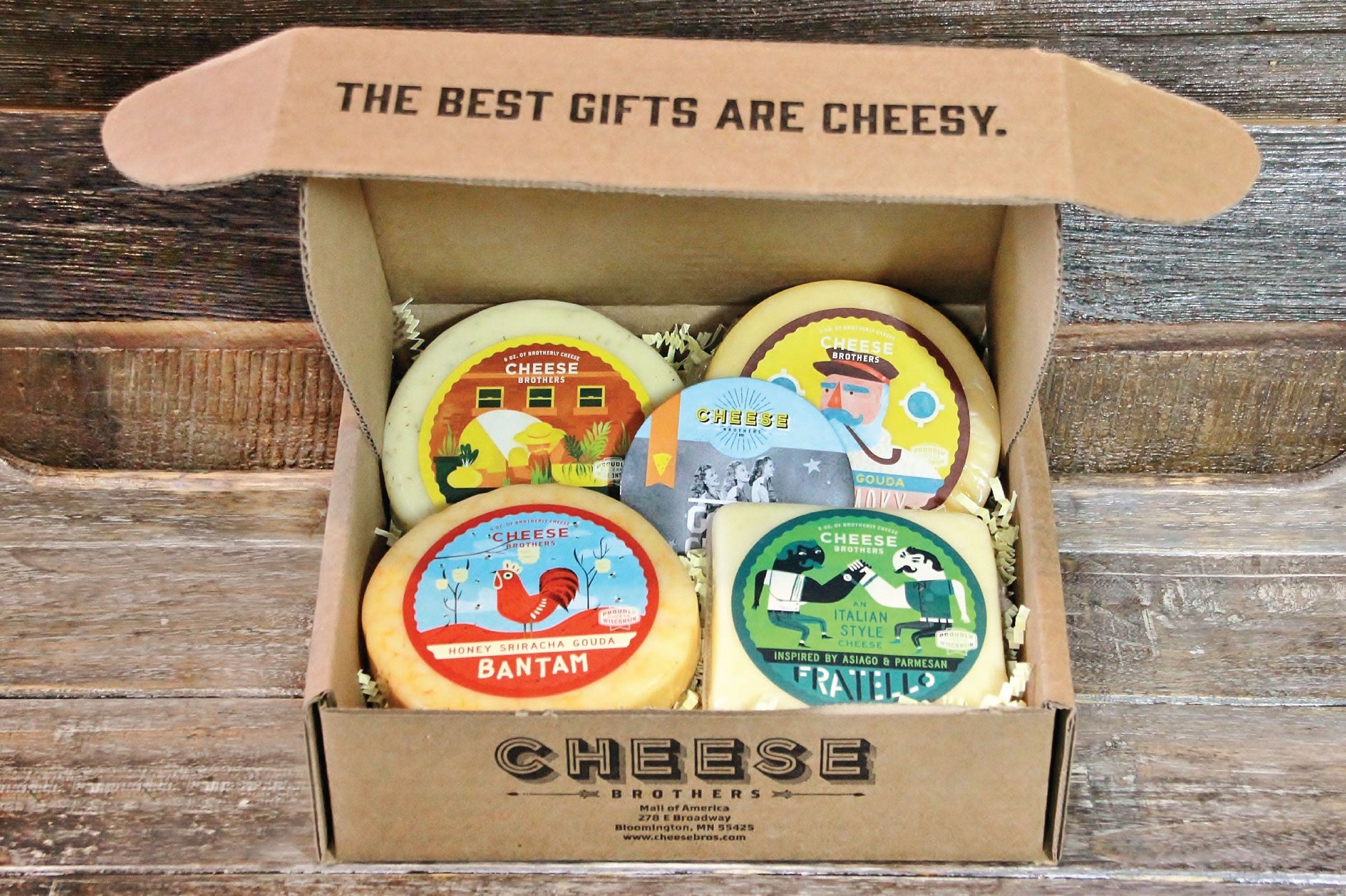 Wisconsin Cheese Brothers, Inc. cheese sampler pack featuring four varieties of Wisconsin cheese in a gift bundle.