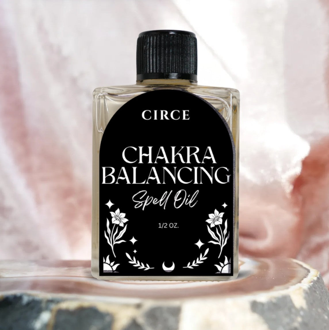 Bottle of Circe Boutique Chakra Balancing Oil for energy alignment, featuring a dropper and calming packaging.